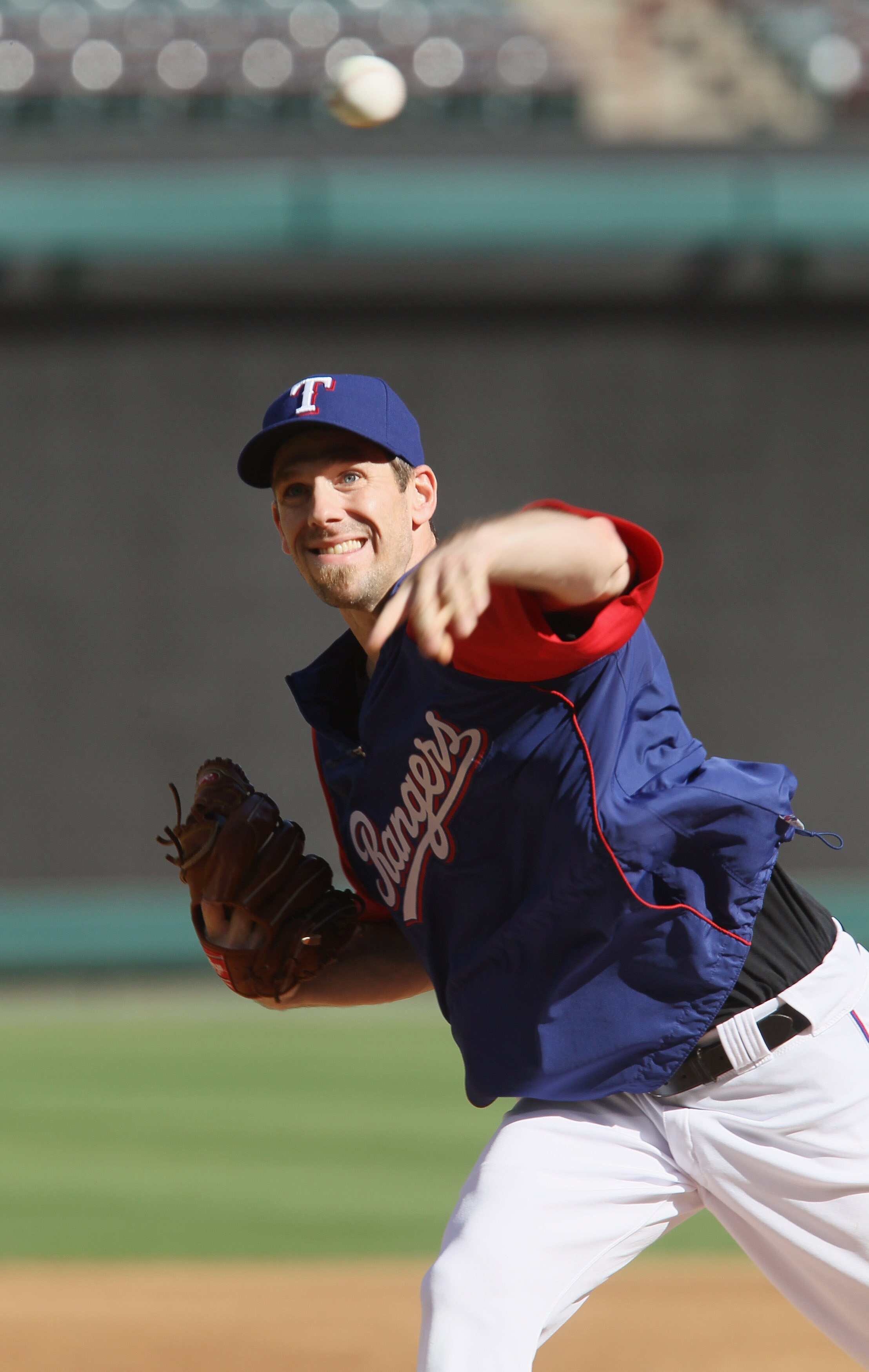 ARLINGTON, TX - OCTOBER 14:  Cliff Lee #33 of the Texas Rangers delivers a pitch during their workout session on October 14, 2010  at the Rangers Ballpark in Arlington in Arlington, Texas.  (Photo by Elsa/Getty Images)