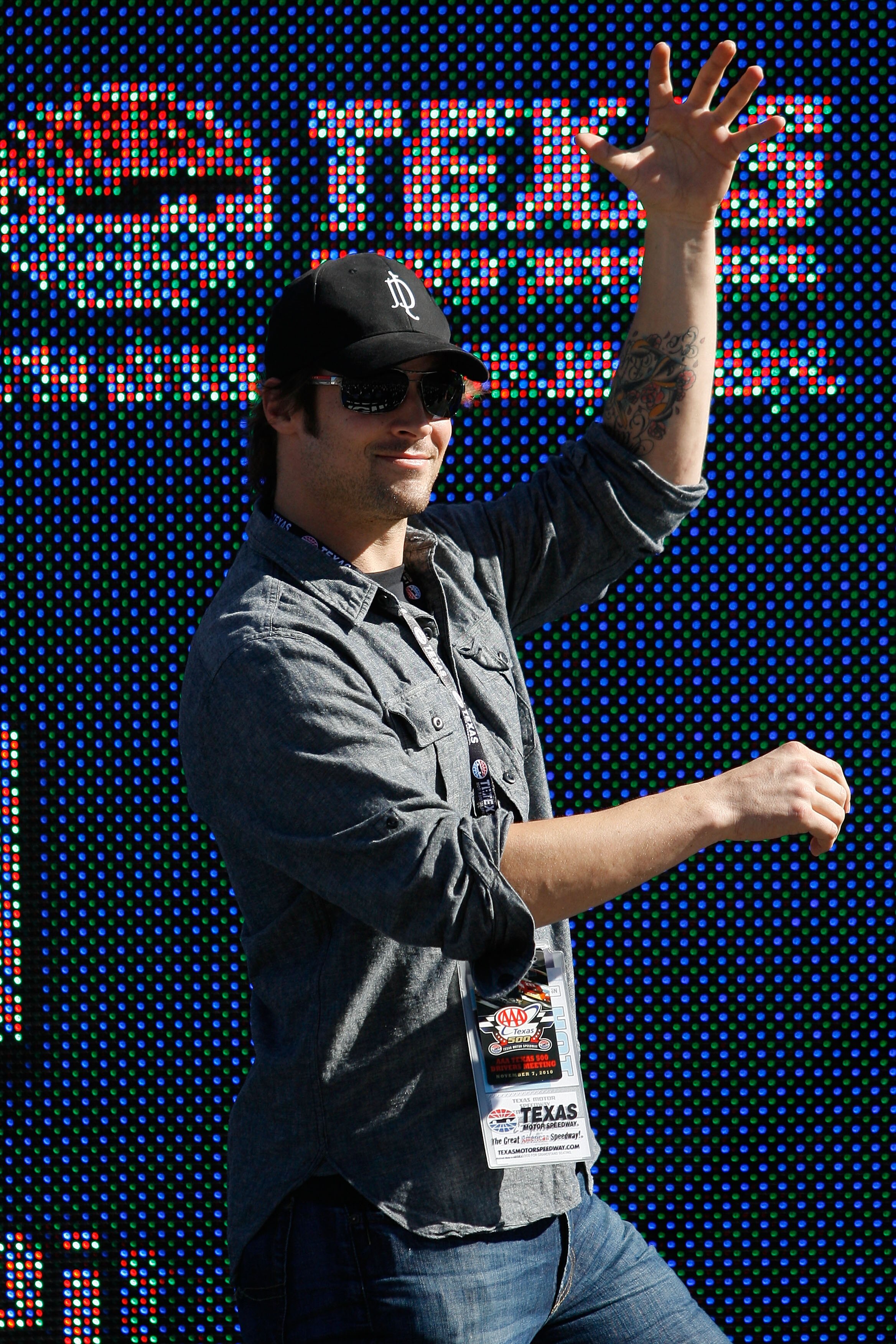 FORT WORTH, TX - NOVEMBER 07:  Texas Rangers starting pitcher and Official Pace Car Driver C.J. Wilson takes part in pre-race ceremonies prior to the NASCAR Sprint Cup Series AAA Texas 500 at Texas Motor Speedway on November 7, 2010 in Fort Worth, Texas.