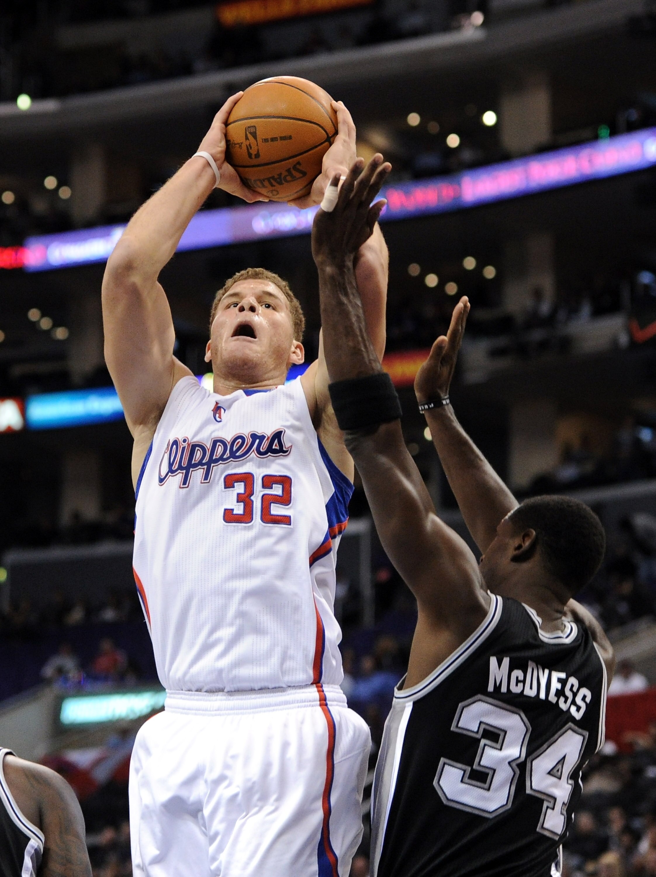 LOS ANGELES, CA - DECEMBER 01:  Blake Griffin #32 of the Los Angeles Clippers shoots a jumper over Antonio McDyess #34 of the San Antonio Spurs at the Staples Center on December 1, 2010 in Los Angeles, California.  NOTE TO USER: User expressly acknowledge