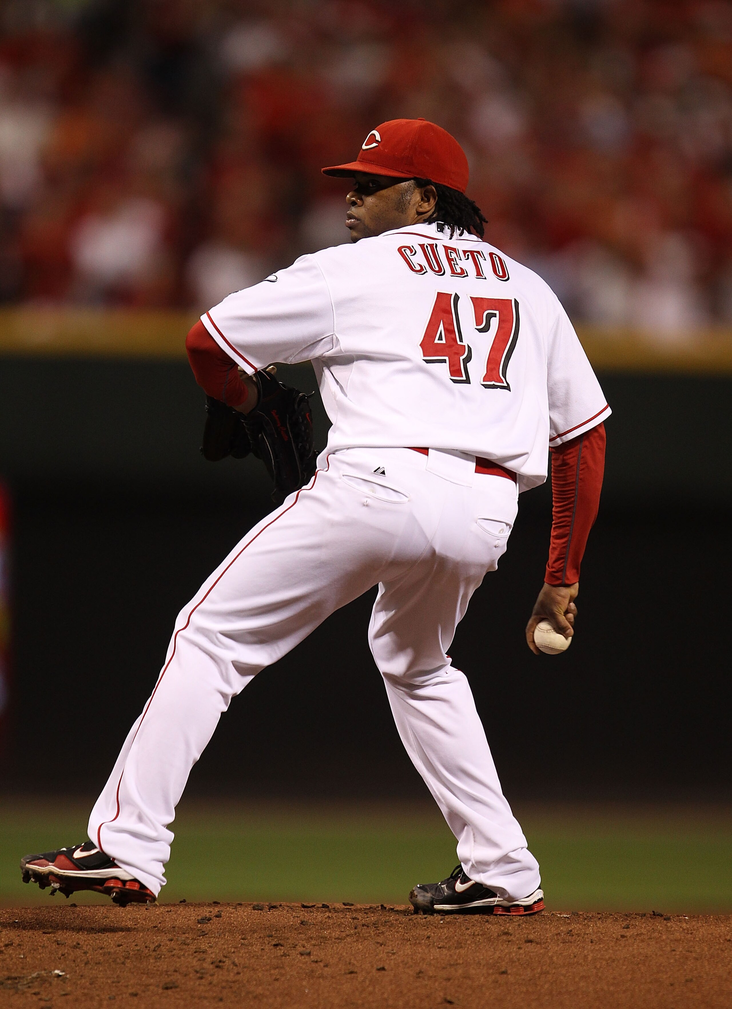 CINCINNATI - OCTOBER 10: Starting pitcher Johnny Cueto #47 of the Cincinnati Reds delivers the ball against the Philadelphia Phillies during game 3 of the NLDS at Great American Ball Park on October 10, 2010 in Cincinnati, Ohio. The Phillies defeated the