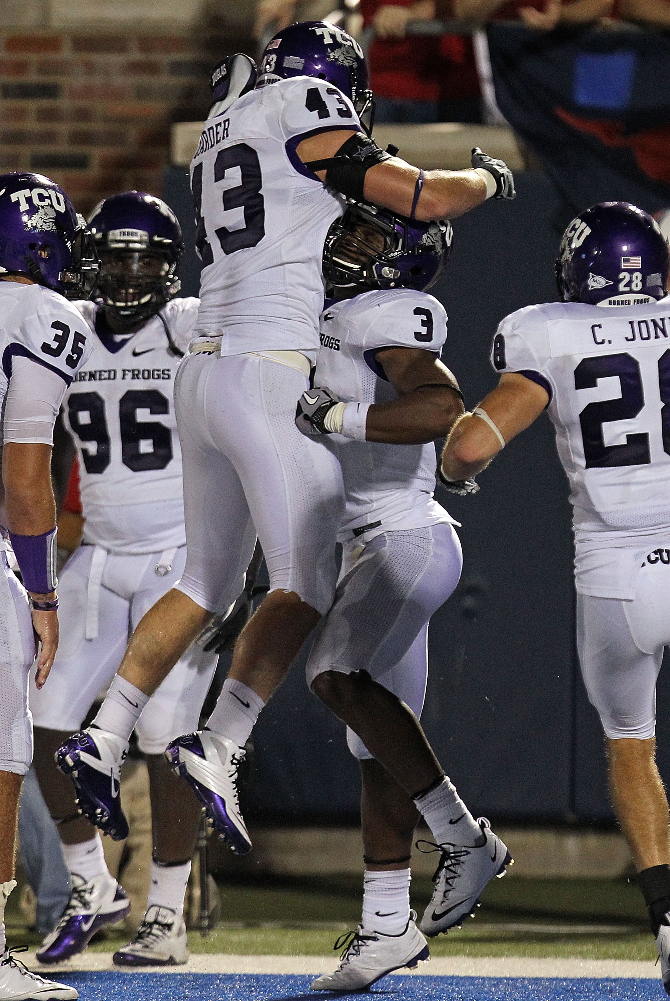 DALLAS - SEPTEMBER 24: Safety Tejay Johnson #3 of the TCU Horned Frogs celebrates his touchdown pass interception with Tank Carder #43 in the fourth quarter against the SMU Mustangs at Gerald J. Ford Stadium on September 24, 2010 in Dallas, Texas. (Phot DALLAS - SEPTEMBER 24: Safety Tejay Johnson #3 of the TCU Horned Frogs celebrates his touchdown pass interception with Tank Carder #43 in the fourth quarter against the SMU Mustangs at Gerald J. Ford Stadium on September 24, 2010 in Dallas, Texas. (Phot