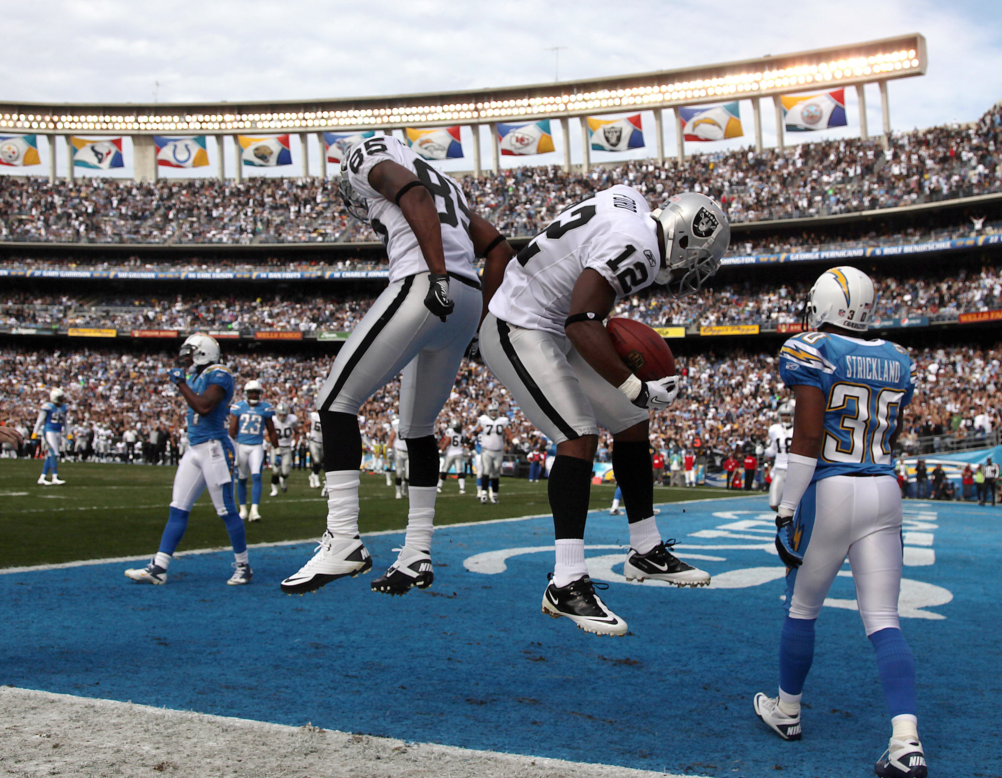 SAN DIEGO, CA - DECEMBER 5:  Wide Receiver Jacoby Ford #12 and Darius Heyward-Bey #85 of the Oakland Raiders celebrate Ford's touchdown catch in front of Donald Strickland #30 of the San Diego Chargers a during their NFL game at Qualcomm Stadium on Decemb