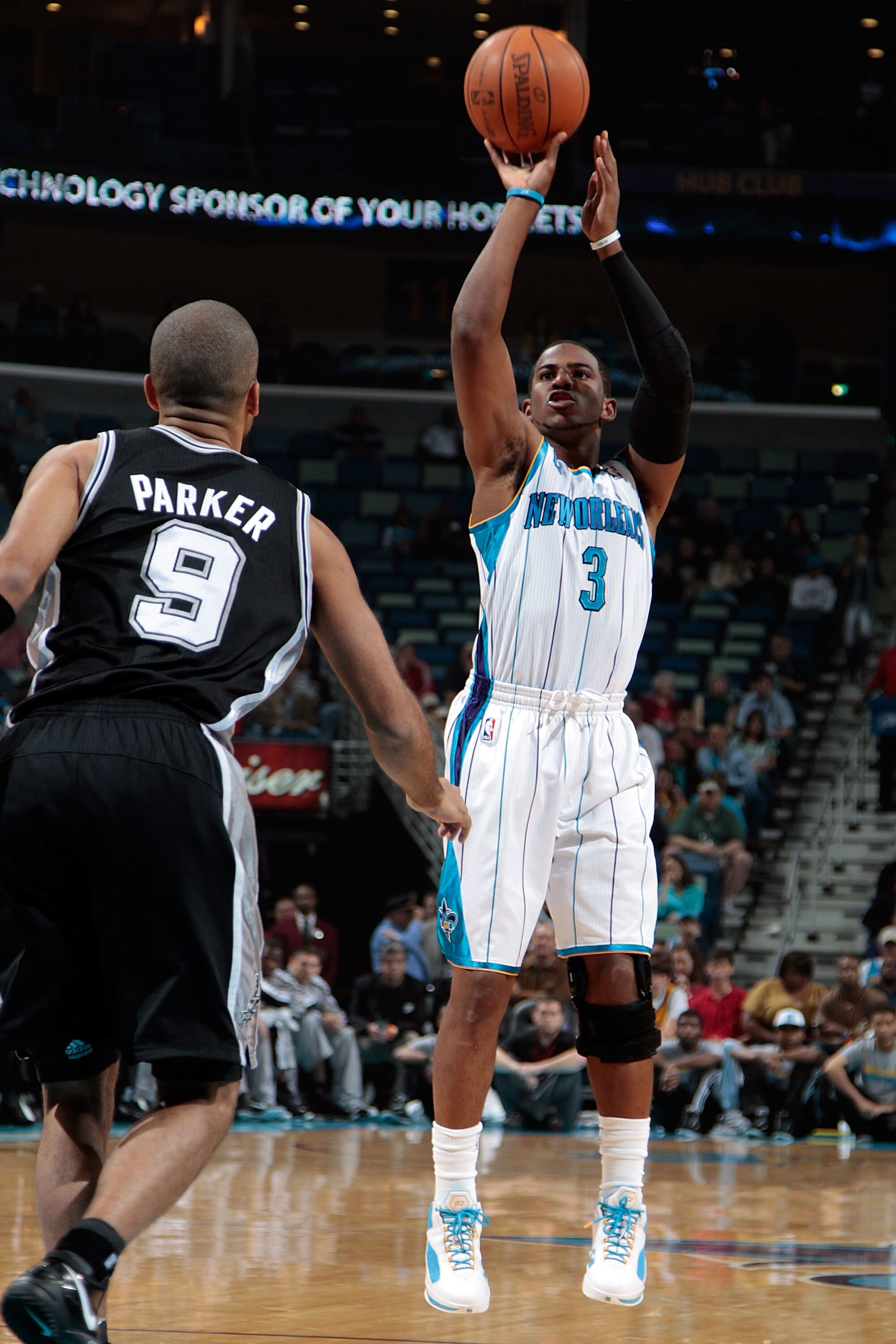 NEW ORLEANS - NOVEMBER 28:  Chris Paul #3 of the New Orleans Hornets shoots the ball over Tony Parker #9 of the San Antonio Spurs at the New Orleans Arena on November 28, 2010 in New Orleans, Louisiana.  NOTE TO USER: User expressly acknowledges and agree