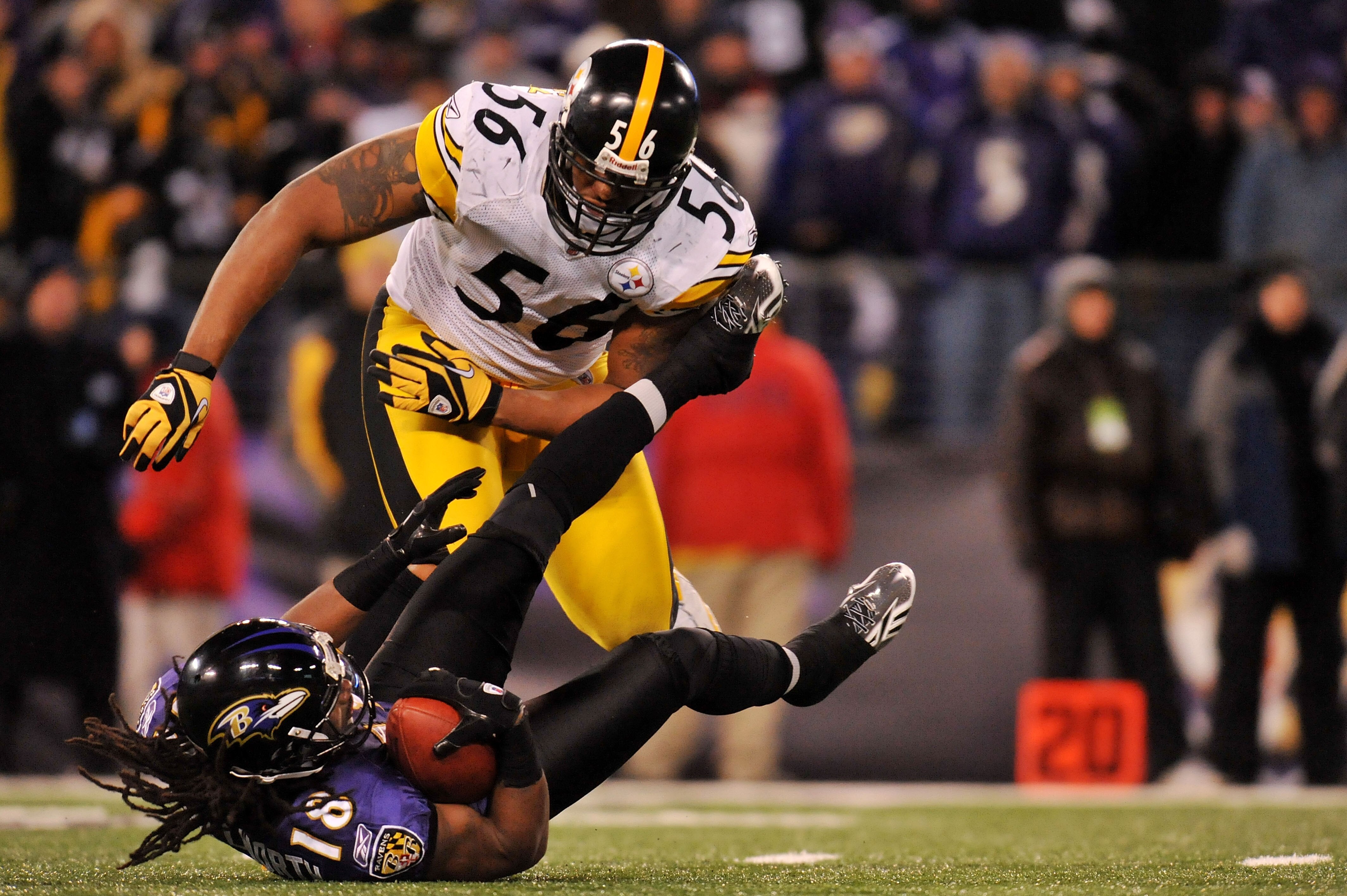 BALTIMORE, MD - DECEMBER 05:  Wide receiver Donte' Stallworth #18 of the Baltimore Ravens is tackeled behind the line of scrimmage by linebacker LaMarr Woodley #56 of the Pittsburgh Steelers during the fourth quarter of the game at M&T Bank Stadium on Dec