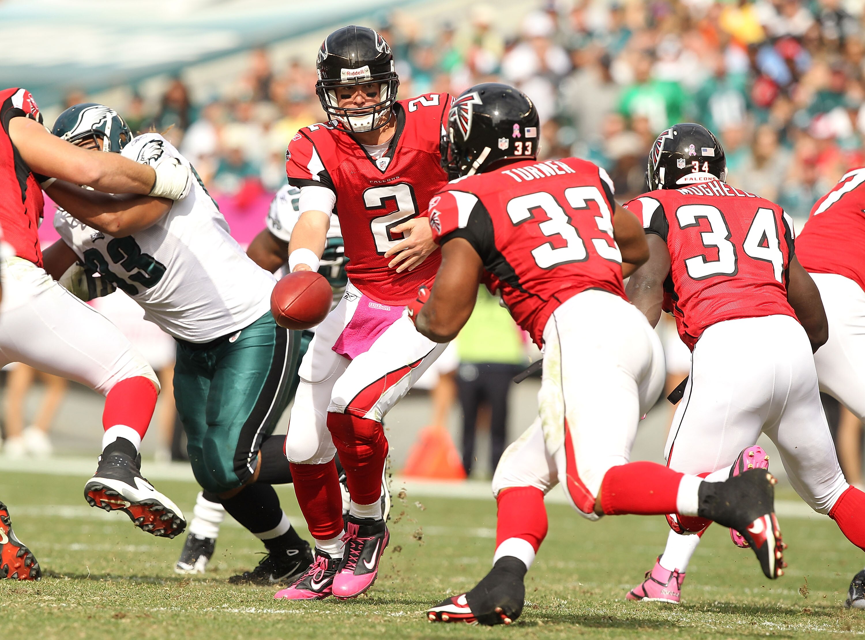 PHILADELPHIA - OCTOBER 17: Matt Ryan #2 hands off to  Michael Turner #33 of the Atlanta Falcons in action against  the Philadelphia Eagles during their game at Lincoln Financial Field on October 17, 2010 in Philadelphia, Pennsylvania.  (Photo by Al Bello/