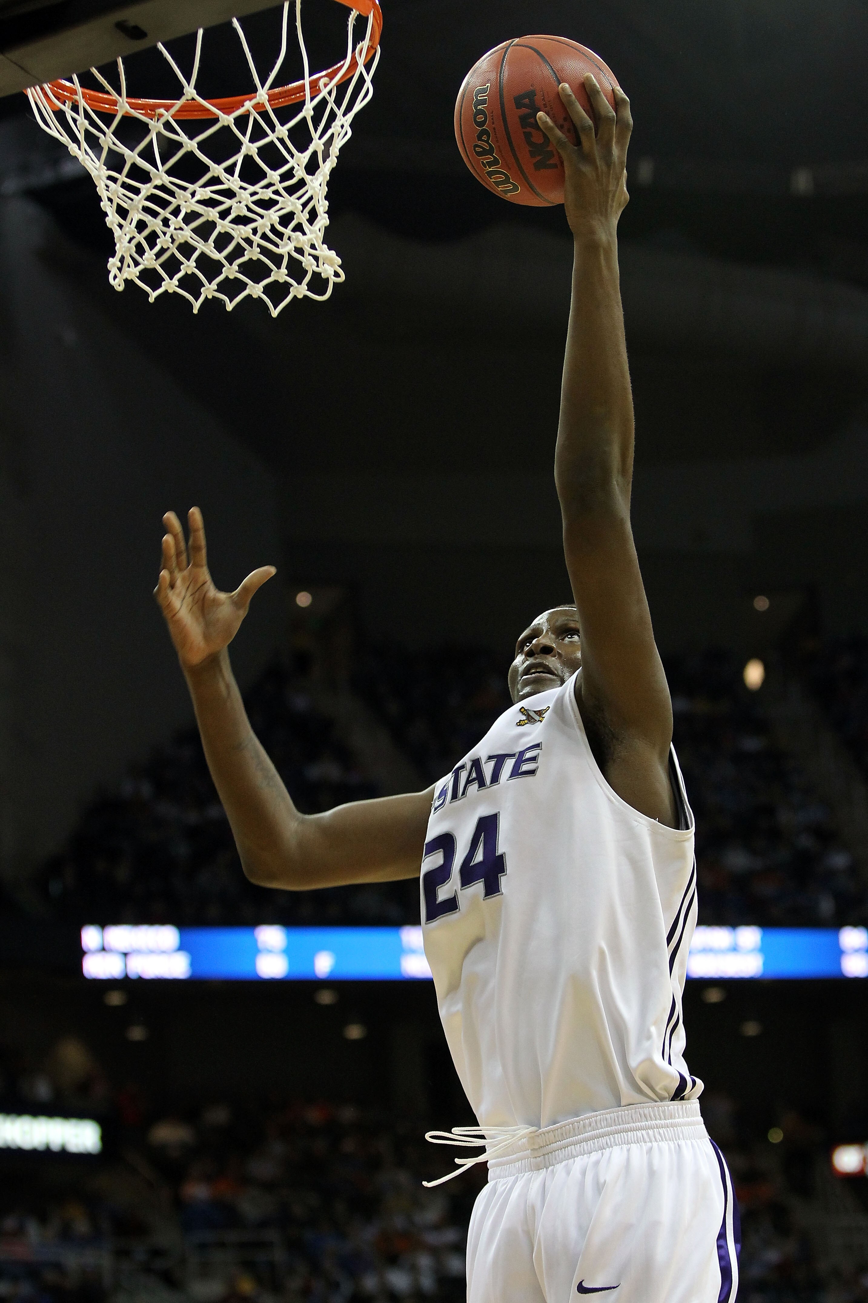KANSAS CITY, MO - MARCH 11:  Curtis Kelly #24 of the Kansas State Wildcats lays the ball up during the quarterfinals of the 2010 Phillips 66 Big 12 Men's Basketball Tournament against the Oklahoma State Cowboys at the Sprint Center on March 11, 2010 in Ka