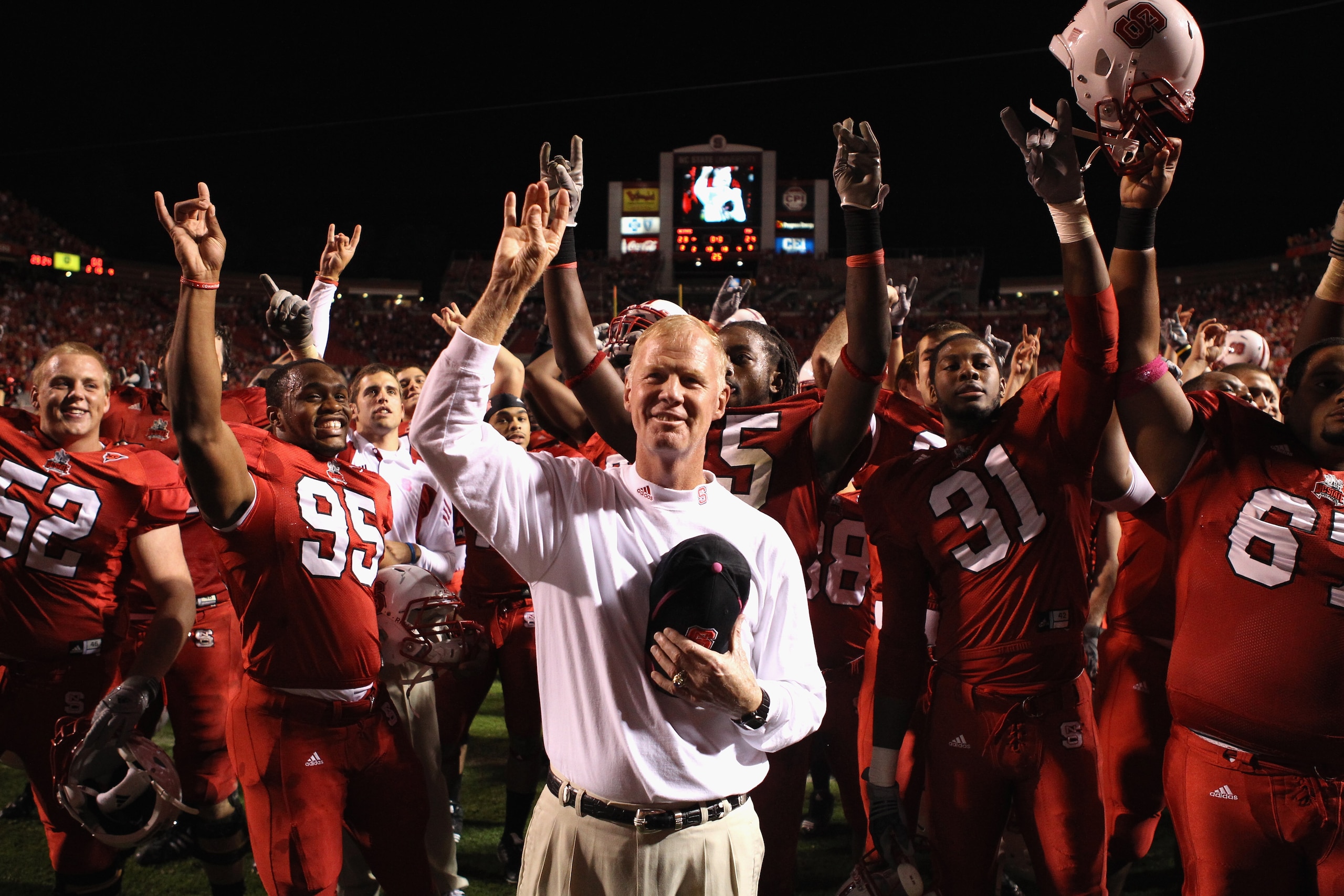 RALEIGH, NC - OCTOBER 28:  Head coach Tom O'Brien of the North Carolina State Wolfpack celebrates with his team after defeating the Florida State Seminoles 28-24 during their game at Carter-Finley Stadium on October 28, 2010 in Raleigh, North Carolina.  (