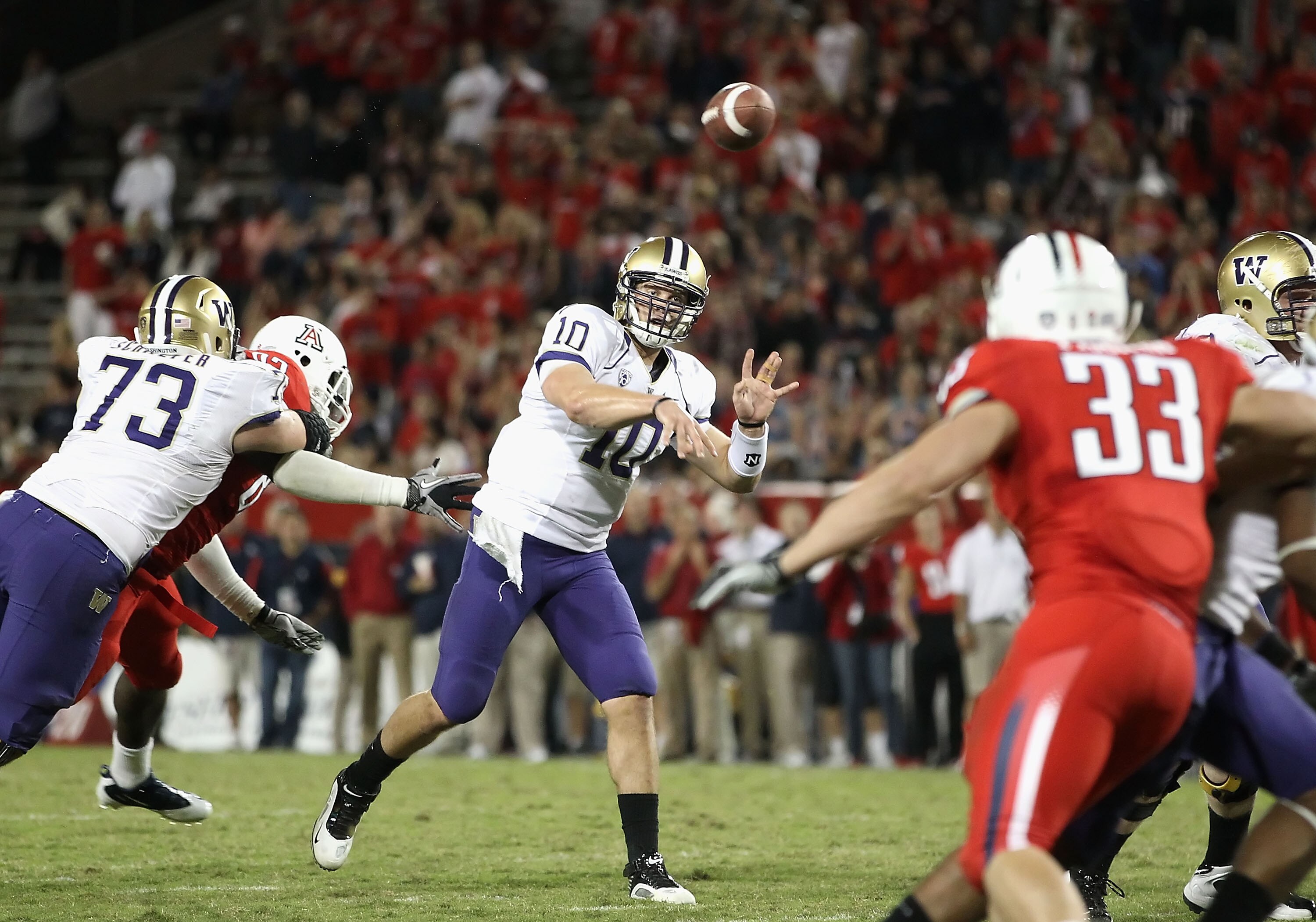 TUCSON, AZ - OCTOBER 23:  Quarterback Jake Locker #10 of the Washington Huskies drops back to pass during the college football game against the Arizona Wildcats at Arizona Stadium on October 23, 2010 in Tucson, Arizona. The Wildcats defeated the Huskies 4