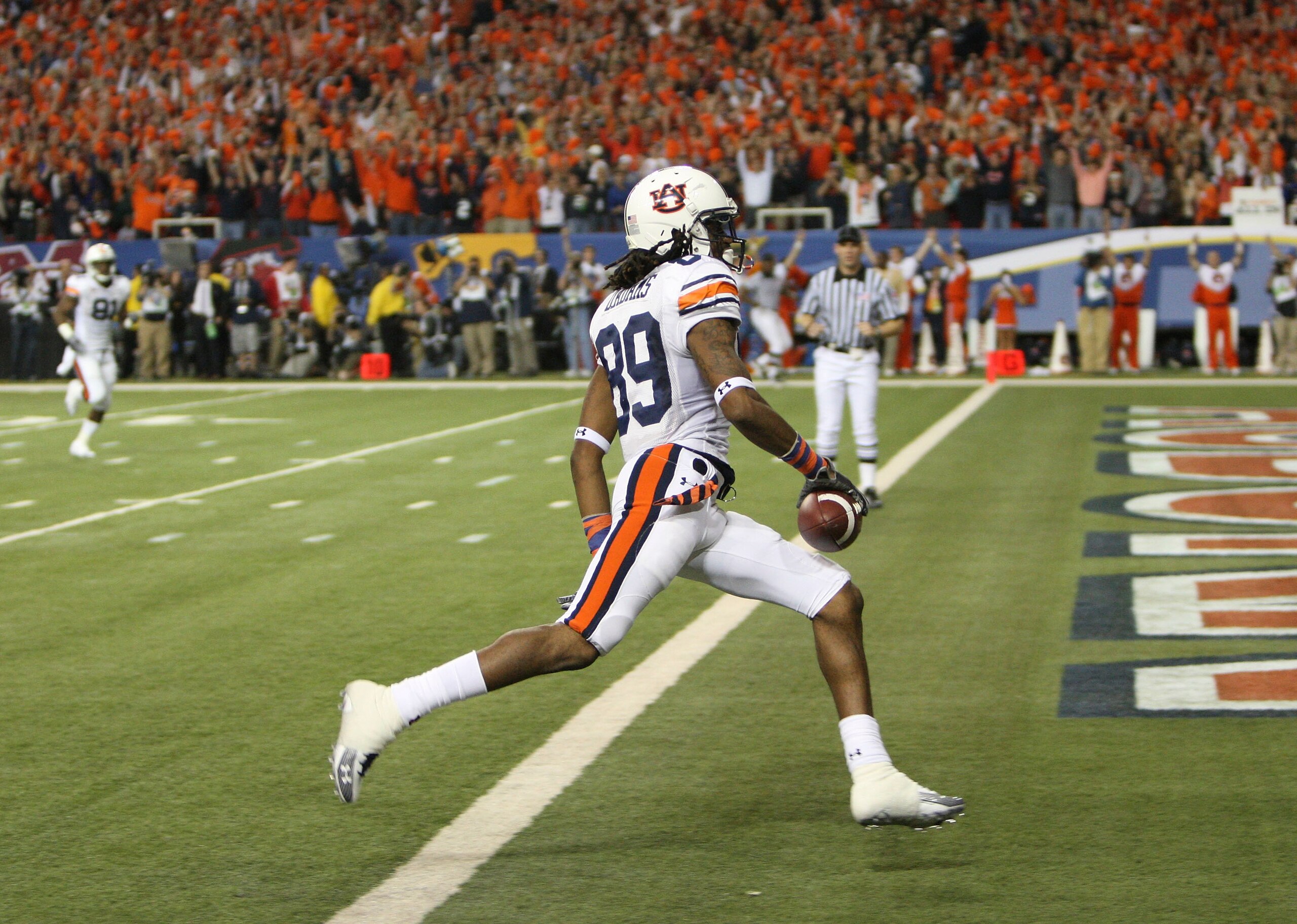 ATLANTA - DECEMBER 4: Wide receiver Darvin Adams #89 of the Auburn Tigers cross the goal line after a reception during the 2010 SEC Championship against the South Carolina Gamecocks at Georgia Dome on December 4, 2010 in Atlanta, Georgia. (Photo by Mike ATLANTA - DECEMBER 4: Wide receiver Darvin Adams #89 of the Auburn Tigers cross the goal line after a reception during the 2010 SEC Championship against the South Carolina Gamecocks at Georgia Dome on December 4, 2010 in Atlanta, Georgia. (Photo by Mike