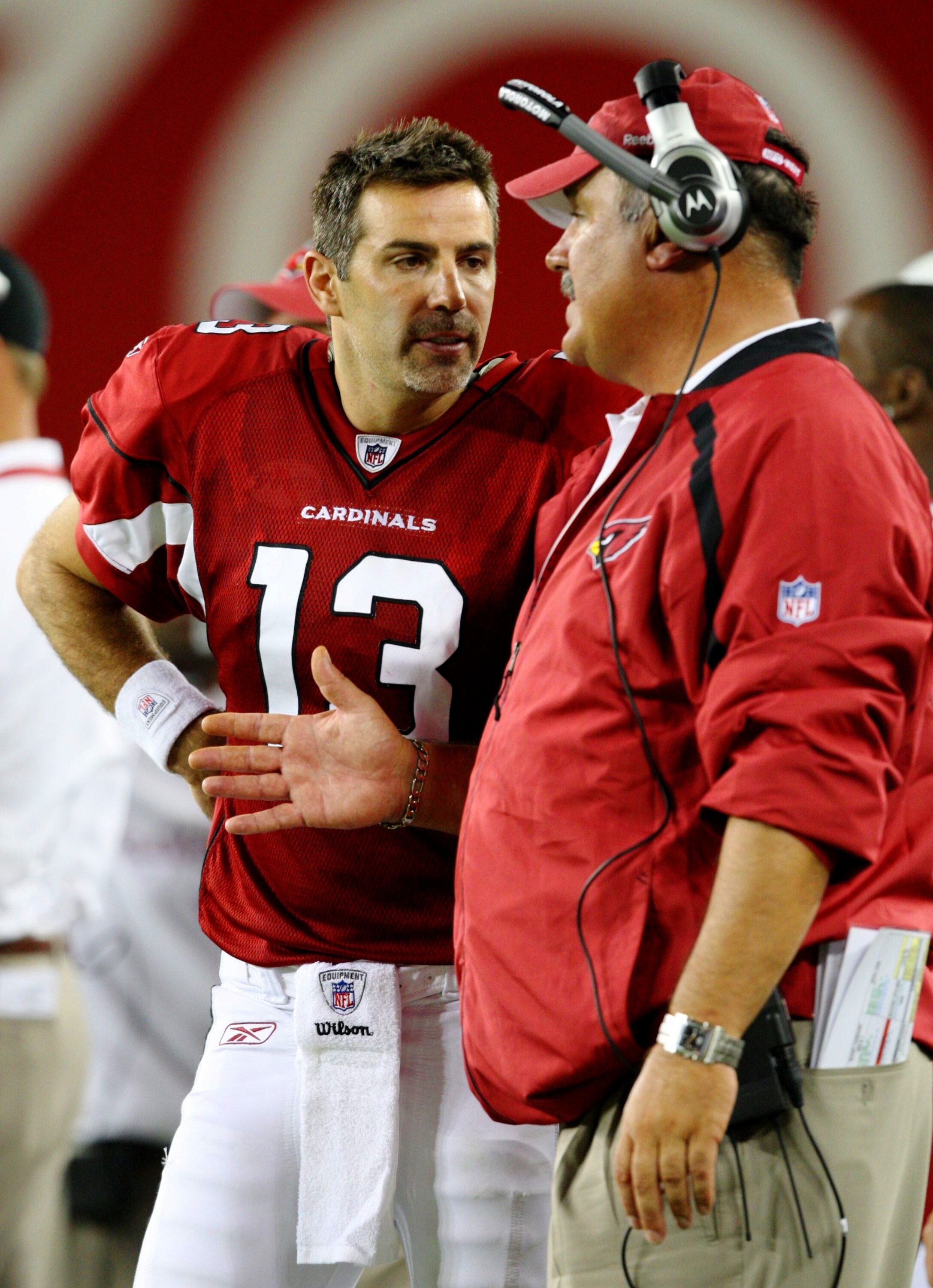 GLENDALE, AZ - AUGUST 22:  Quarterback Kurt Warner #13 of the Arizona Cardinals talks to offensive line coach Russ Grimm during the game against  the San Diego Chargers at the University of Phoenix Stadium on August 22, 2009 in Glendale, Arizona. (Photo b