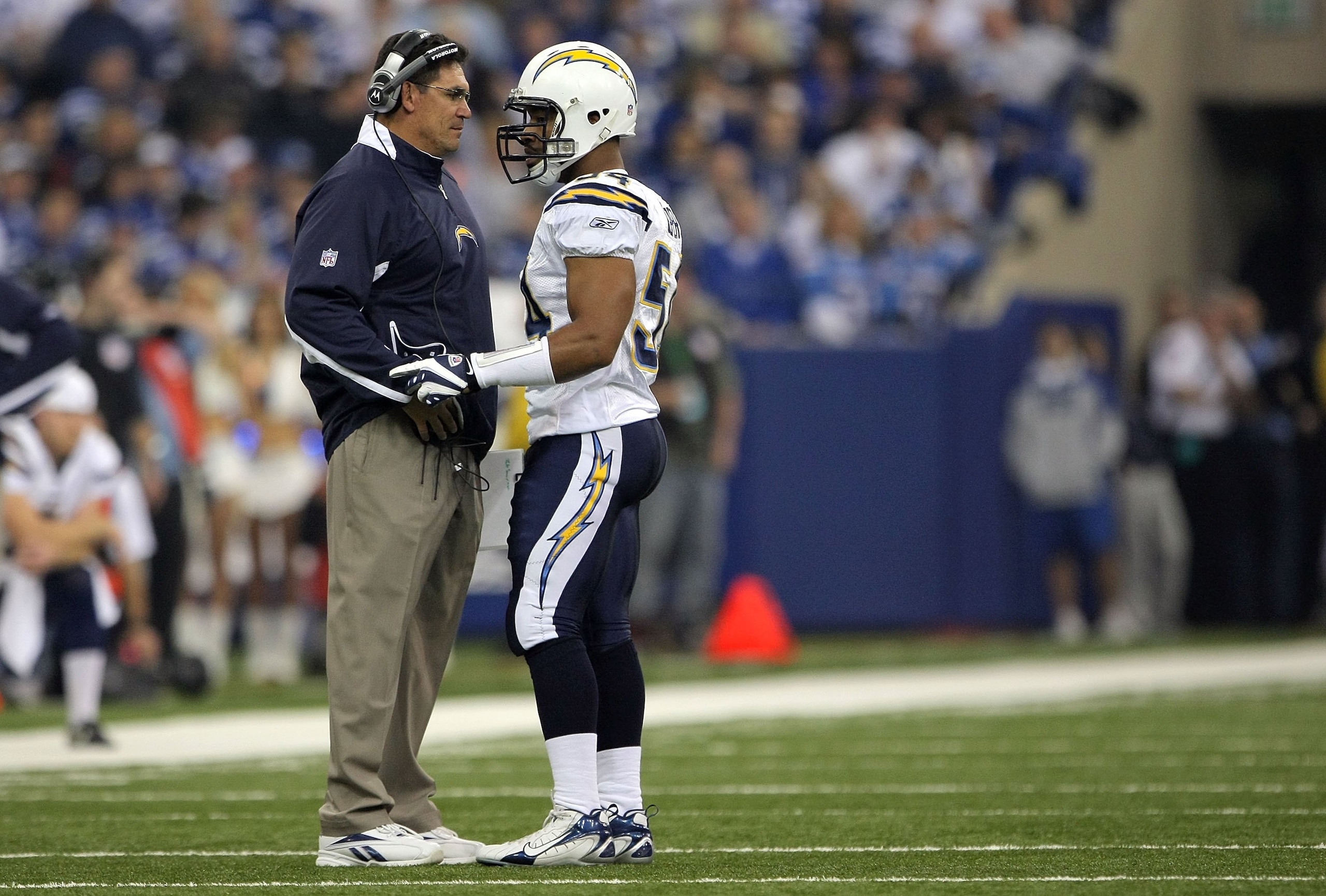 INDIANAPOLIS - JANUARY 13:  (L-R) Inside linebackers coach, Ron Rivera and Stephen Cooper #54 of the San Diego Chargers talk during a stop in play against the Indianapolis Colts during their AFC Divisional Playoff game at the RCA Dome on January 13, 2008