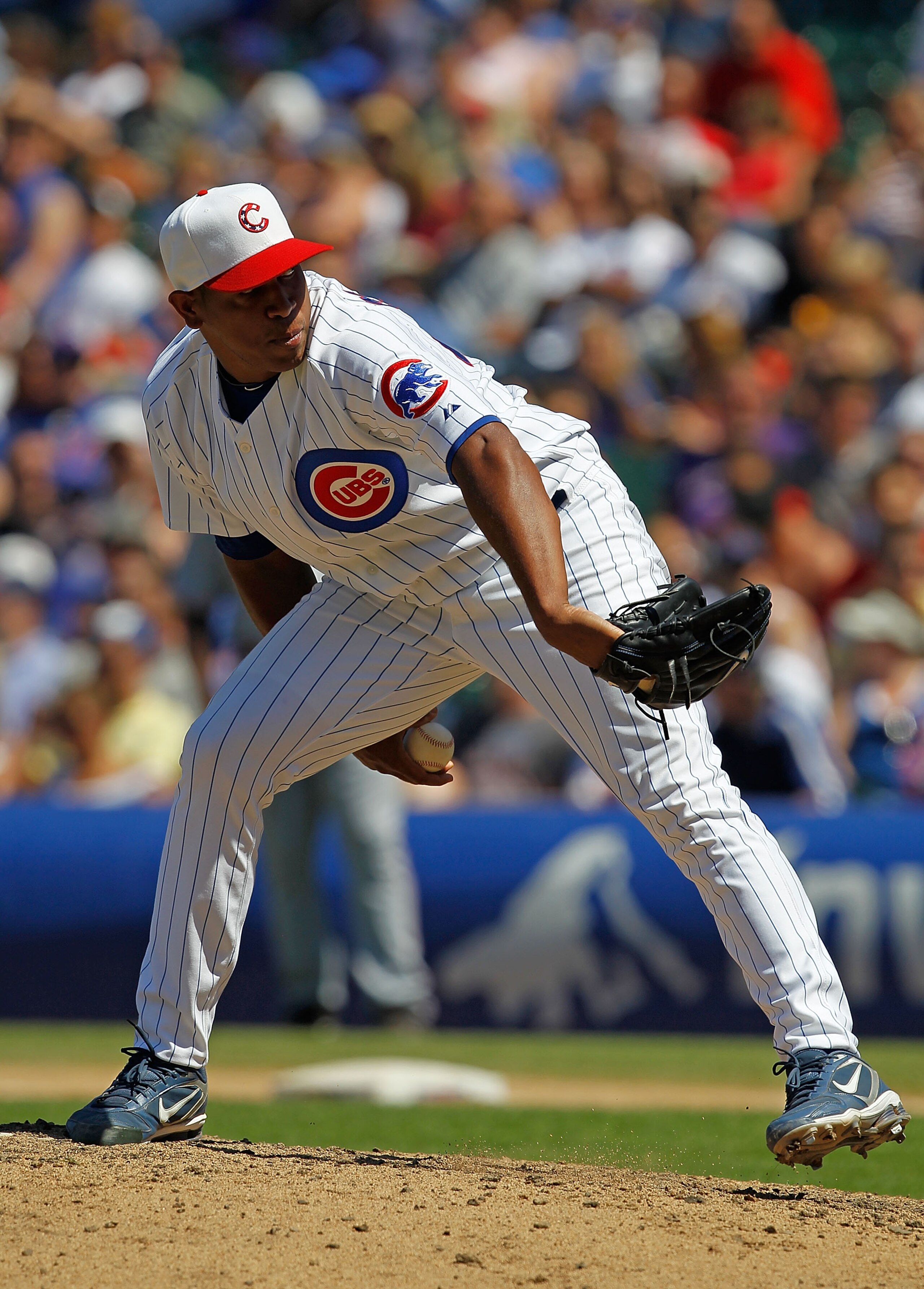 CHICAGO - JULY 03: Carlos Marmol #49 of the Chicago Cubs pitches in the 9th inning on his way to a save against the Cincinnati Reds at Wrigley Field on July 3, 2010 in Chicago, Illinois. The Cubs defeated the Reds 3-1. (Photo by Jonathan Daniel/Getty Imag