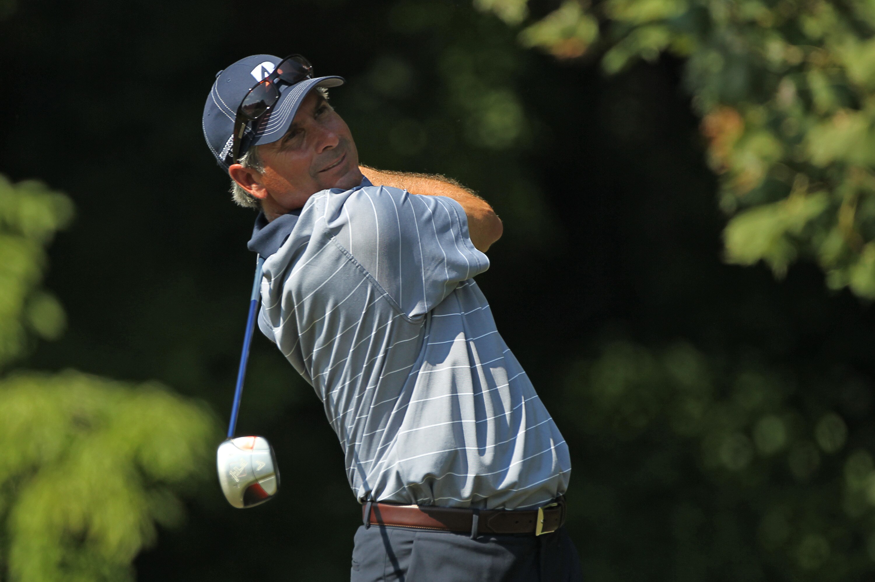 GREENSBORO, NC - AUGUST 20: Fred Couples hits his tee shot on the 13th hole during the second round of the Wyndham Championship at Sedgefield Country Club on August 20, 2010 in Greensboro, North Carolina. (Photo by Hunter Martin/Getty Images)