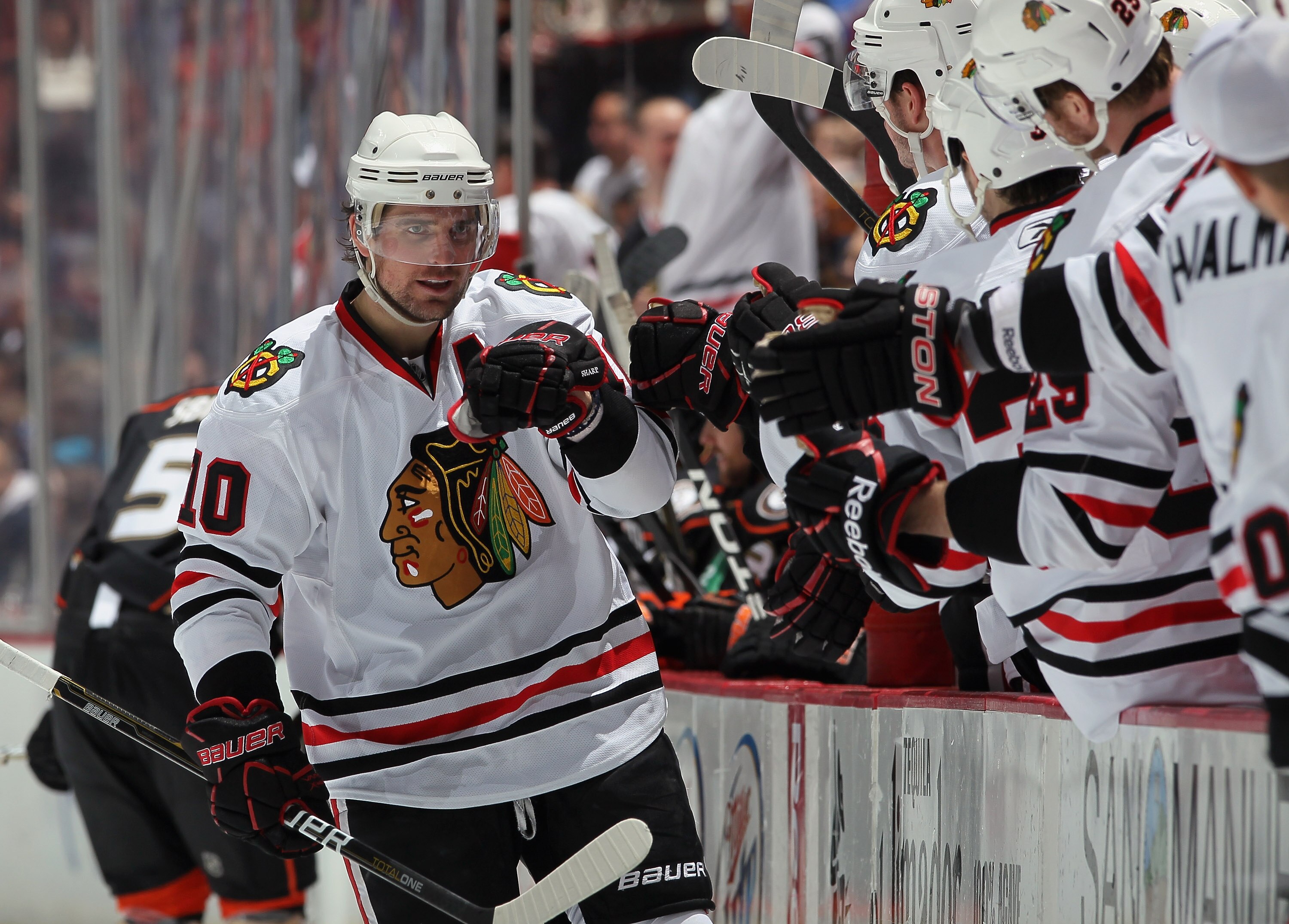 ANAHEIM, CA - NOVEMBER 26:  Patrick Sharp #10 of the Chicago Blackhawks receives high fives from the bench after scoring a goal against the Anaheim Ducks in the third period at the Honda Center on November 26, 2010 in Anaheim, California. The Blackhawks d