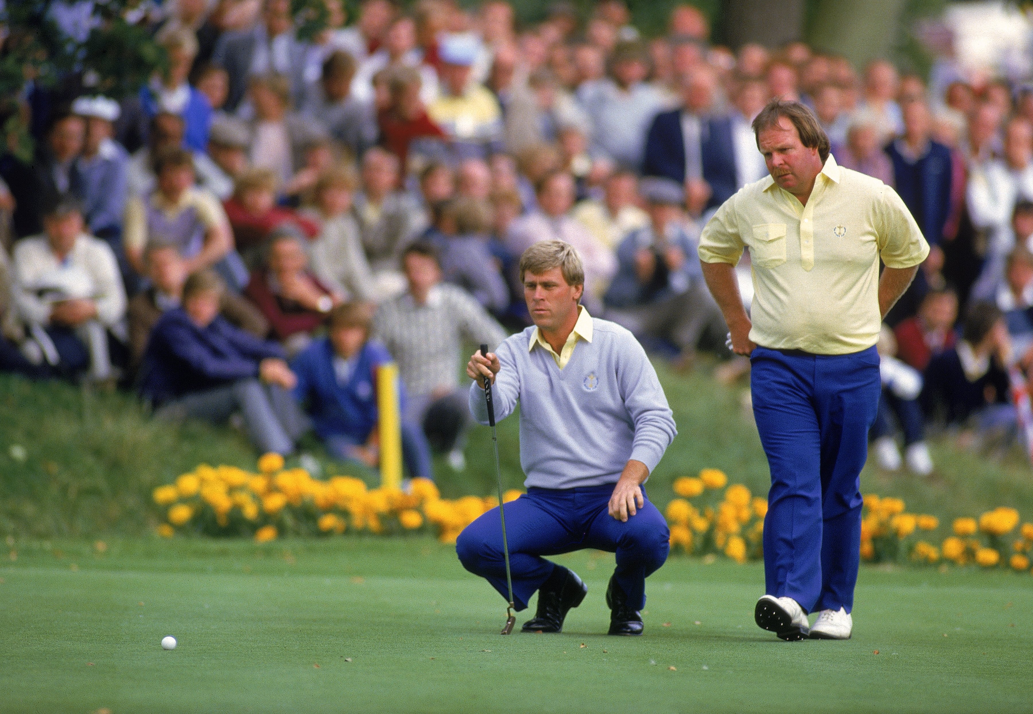 13 Sep 1985:  Hal Sutton lines up a putt alongside USA team partner Craig Stadler during the Ryder Cup at the Belfry in Sutton Coldfield, England. \ Mandatory Credit: David Cannon /Allsport