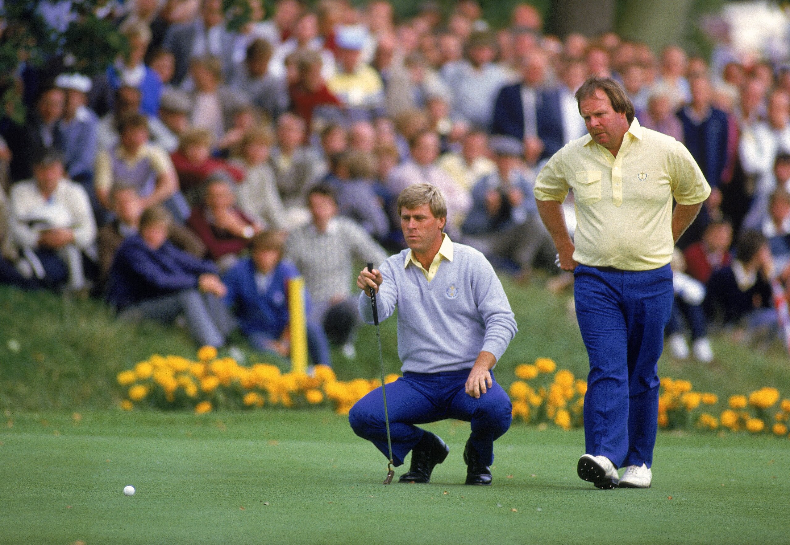 13 Sep 1985:  Hal Sutton lines up a putt alongside USA team partner Craig Stadler during the Ryder Cup at the Belfry in Sutton Coldfield, England. \ Mandatory Credit: David Cannon /Allsport