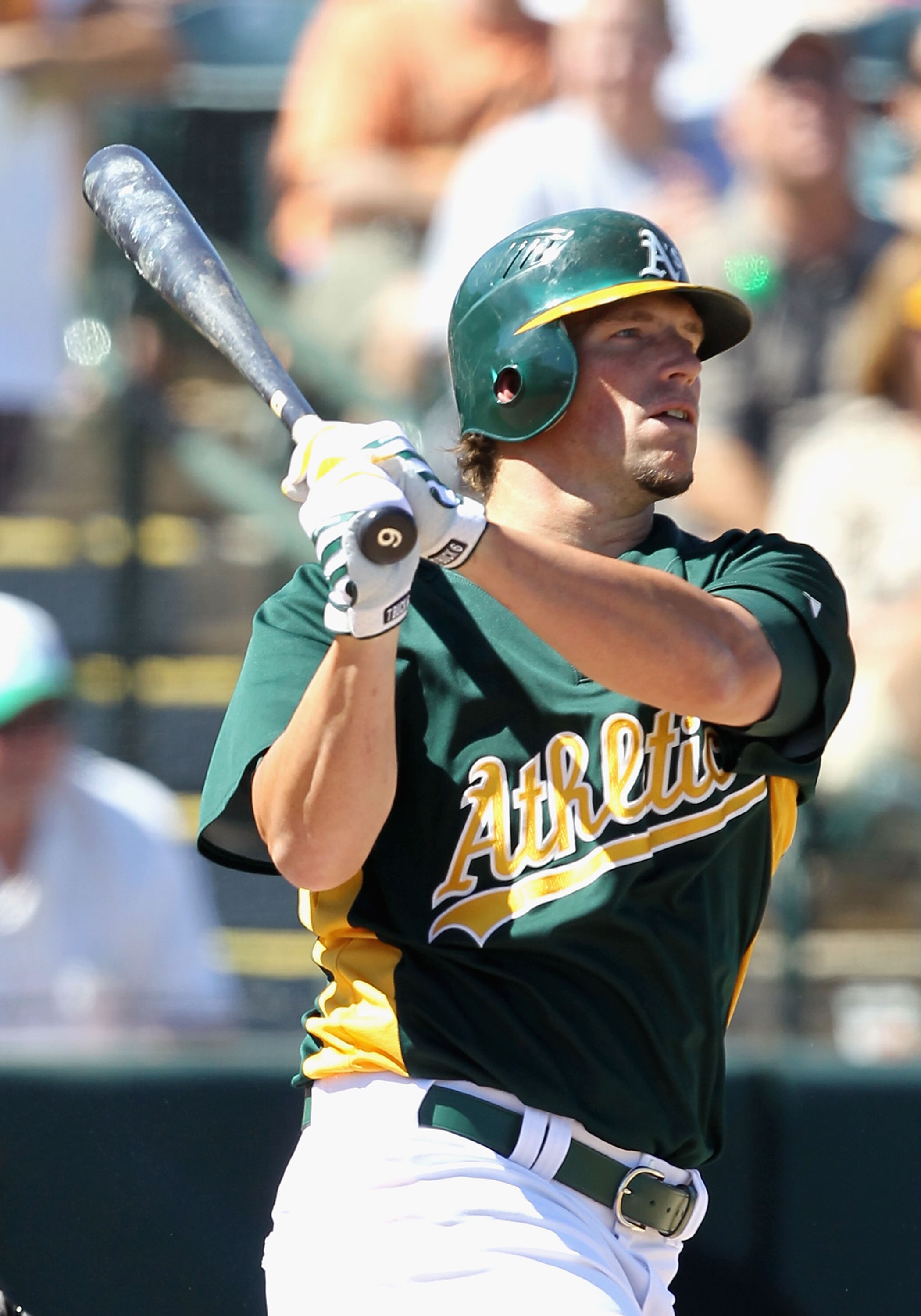 PHOENIX - MARCH 17:  Travis Buck #6 of the Oakland Athletics bats against the San Francisco Giants during the MLB spring training game at Phoenix Municipal Stadium on March 17, 2010 in Phoenix, Arizona.   The Giants defeated the A's 6-1.  (Photo by Christ