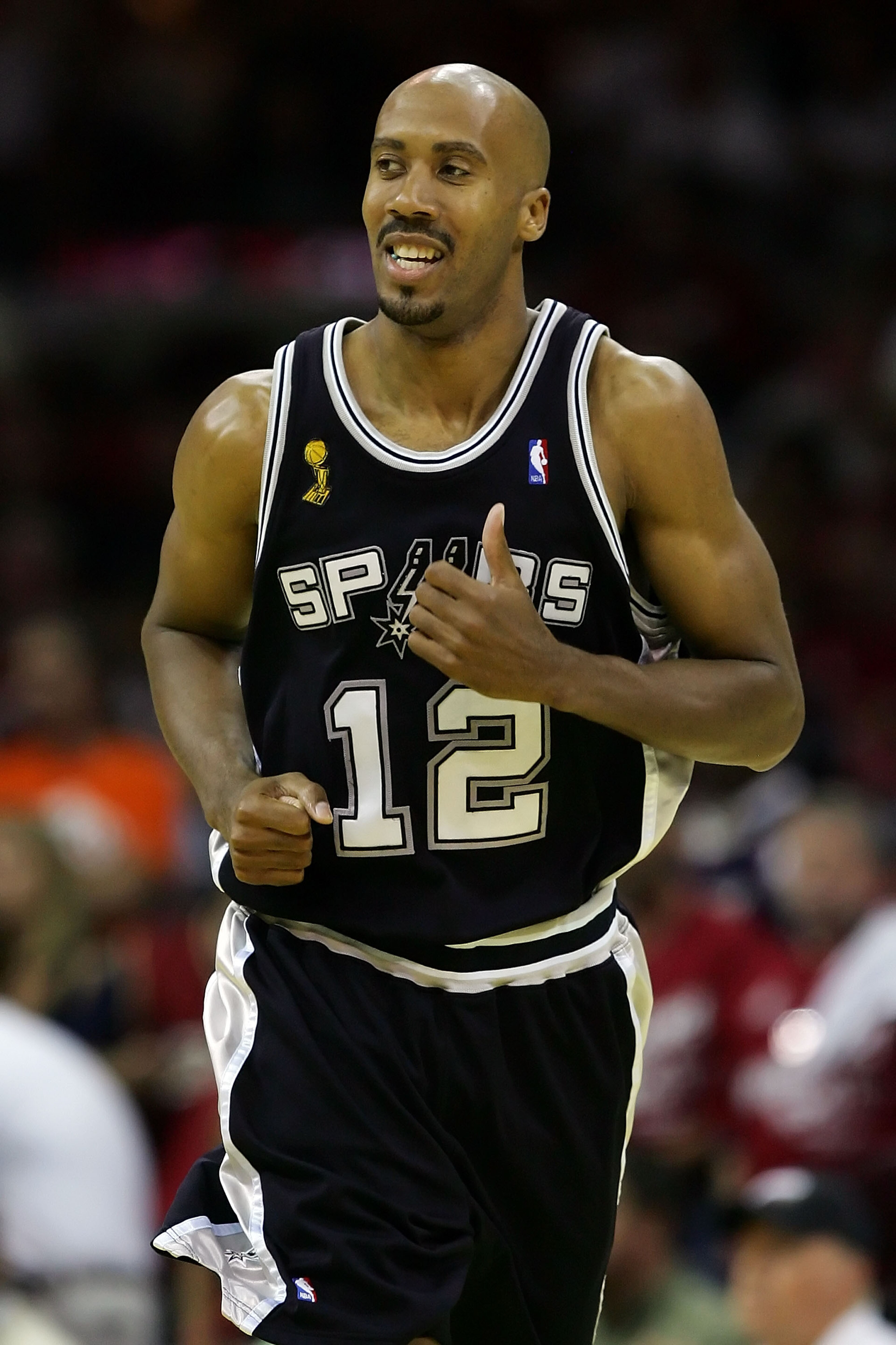 CLEVELAND - JUNE 14: Bruce Bowen #12 of the San Antonio Spurs runs upcourt against the Cleveland Cavaliers in Game Four of the NBA Finals on June 14, 2007 at the Quicken Loans Arena in Cleveland, Ohio. NOTE TO USER: User expressly acknowledges and agrees CLEVELAND - JUNE 14: Bruce Bowen #12 of the San Antonio Spurs runs upcourt against the Cleveland Cavaliers in Game Four of the NBA Finals on June 14, 2007 at the Quicken Loans Arena in Cleveland, Ohio. NOTE TO USER: User expressly acknowledges and agrees