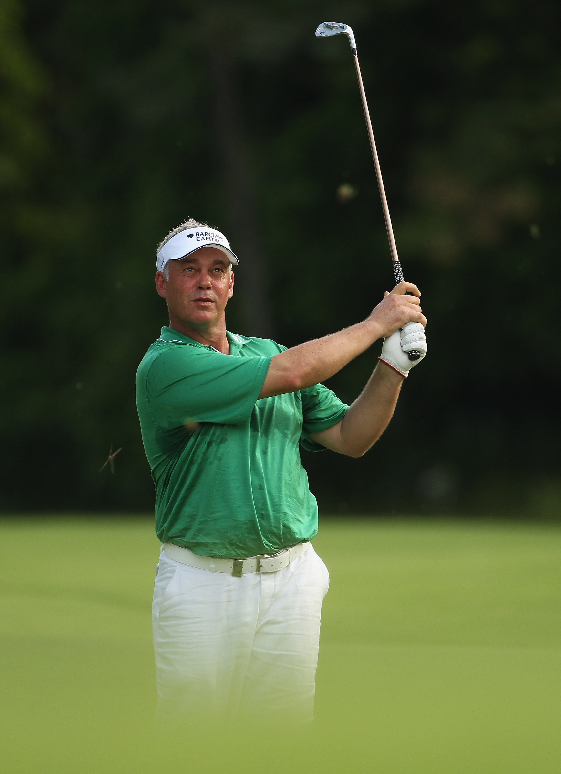 SINGAPORE - NOVEMBER 12:  Darren Clarke of Northern Ireland in action during the Second Round of the Barclays Singapore Open at Sentosa Golf Club on November 12, 2010 in Singapore, Singapore.  (Photo by Ian Walton/Getty Images)