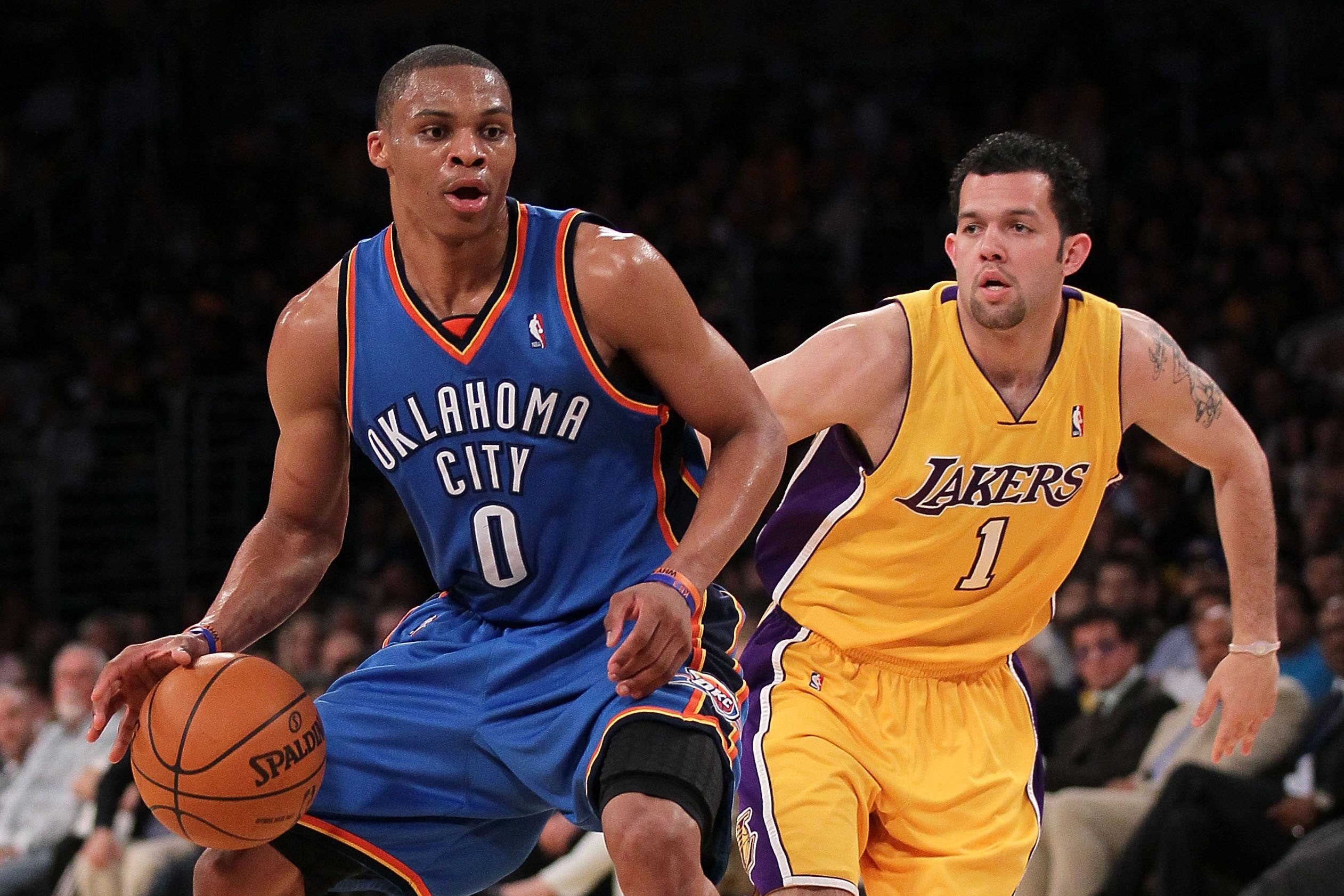 LOS ANGELES, CA - APRIL 27:  Russell Westbrook #0 of the Oklahoma City Thunder drives on Jordan Farmar #1 of the Los Angeles Lakers during Game Five of the Western Conference Quarterfinals of the 2010 NBA Playoffs at Staples Center on April 27, 2010 in Lo