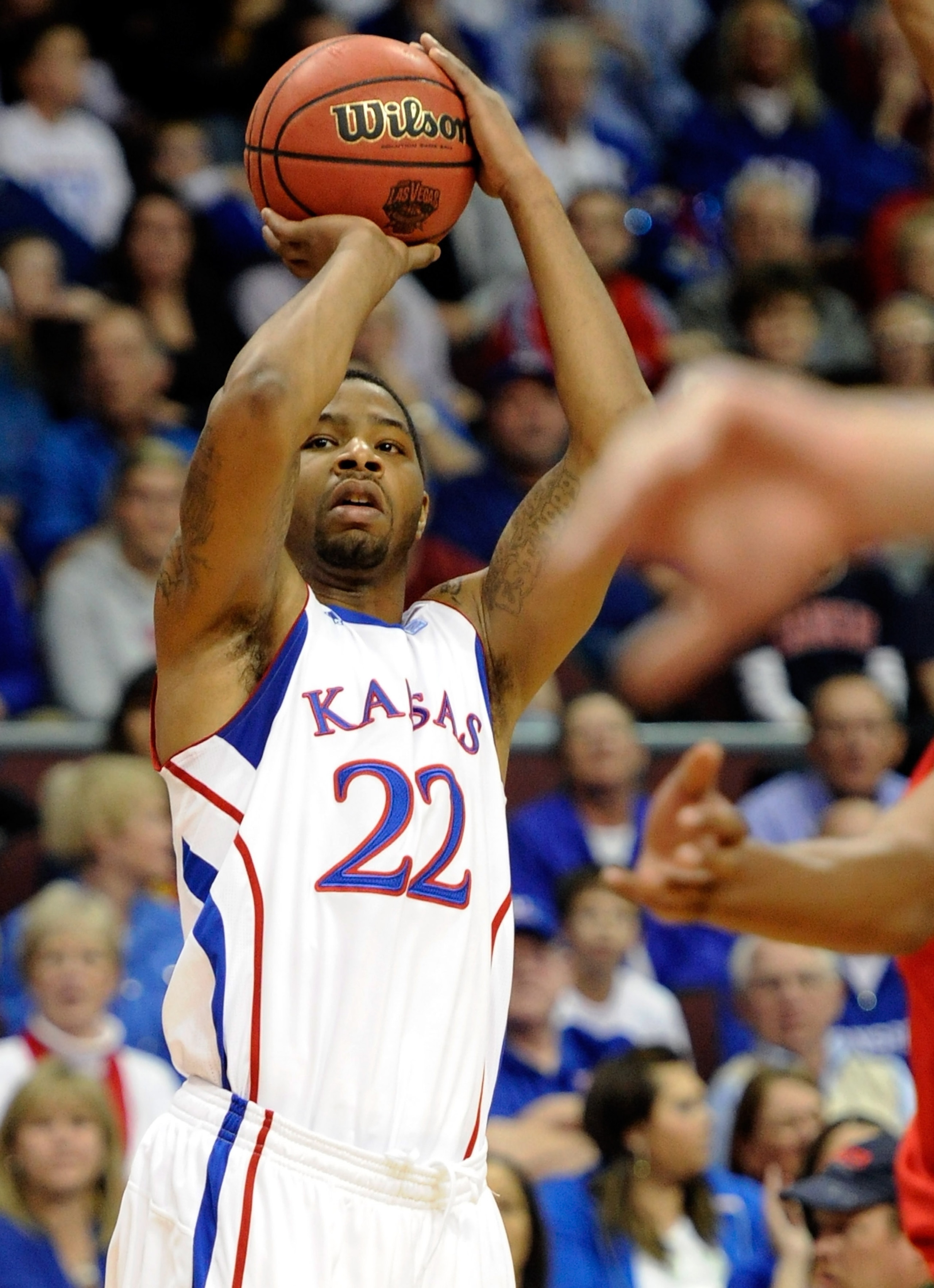 LAS VEGAS - NOVEMBER 27:  Marcus Morris #22 of the Kansas Jayhawks shoots against the Arizona Wildcats during the championship game of the Las Vegas Invitational at The Orleans Arena November 27, 2010 in Las Vegas, Nevada. Kansas won 87-79.  (Photo by Eth