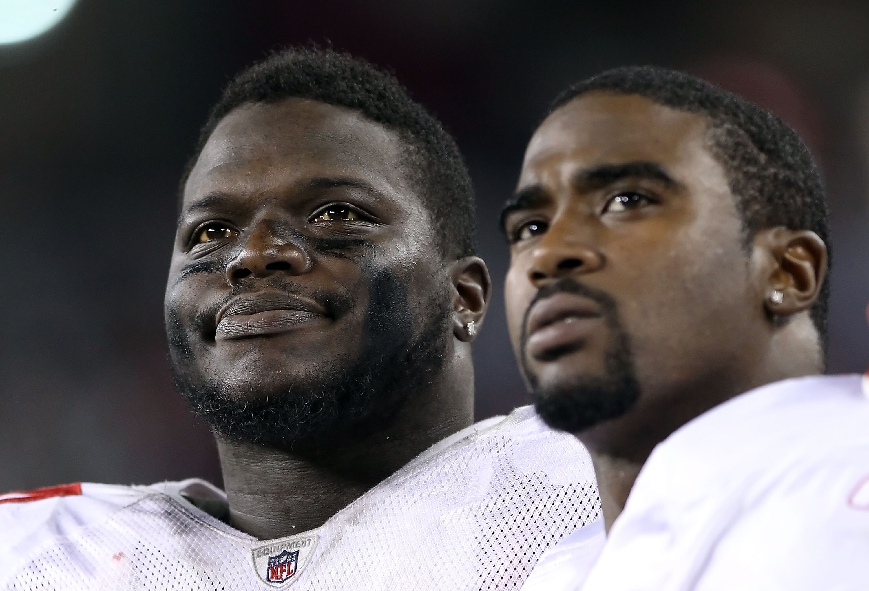 GLENDALE, AZ - NOVEMBER 29:  Anthony Dixon #24  (L) and quarterback Troy Smith #1 (R) of the San Francisco 49ers during the NFL game against the Arizona Cardinals at the University of Phoenix Stadium on November 29, 2010 in Glendale, Arizona. The 49ers de