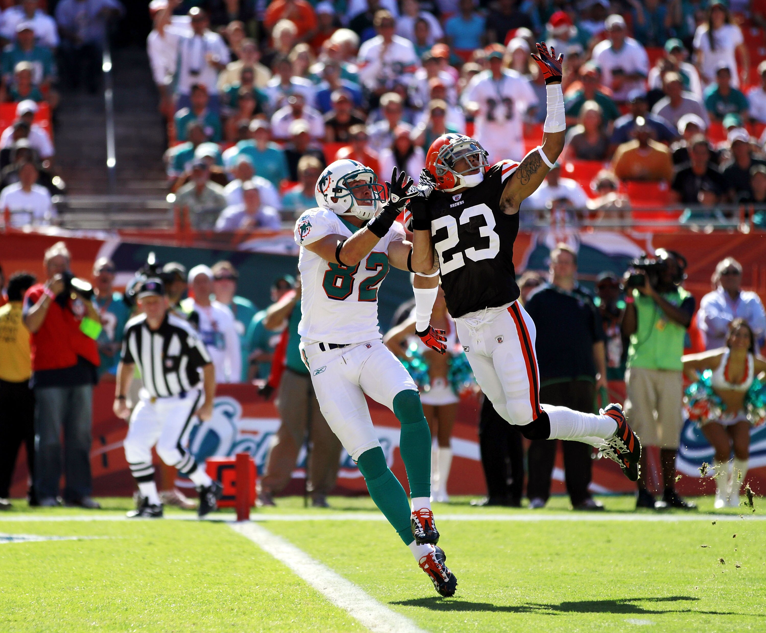 MIAMI, FL - DECEMBER 05:  Defensive back Joe Haden #23 of the Cleveland Browns defends against wide reciever Brian Hartline #82 of the Miami Dolphins at Sun Life Stadium on December 5, 2010 in Miami, Florida.  Cleveland defeated Miami 13-10.  (Photo by Ma