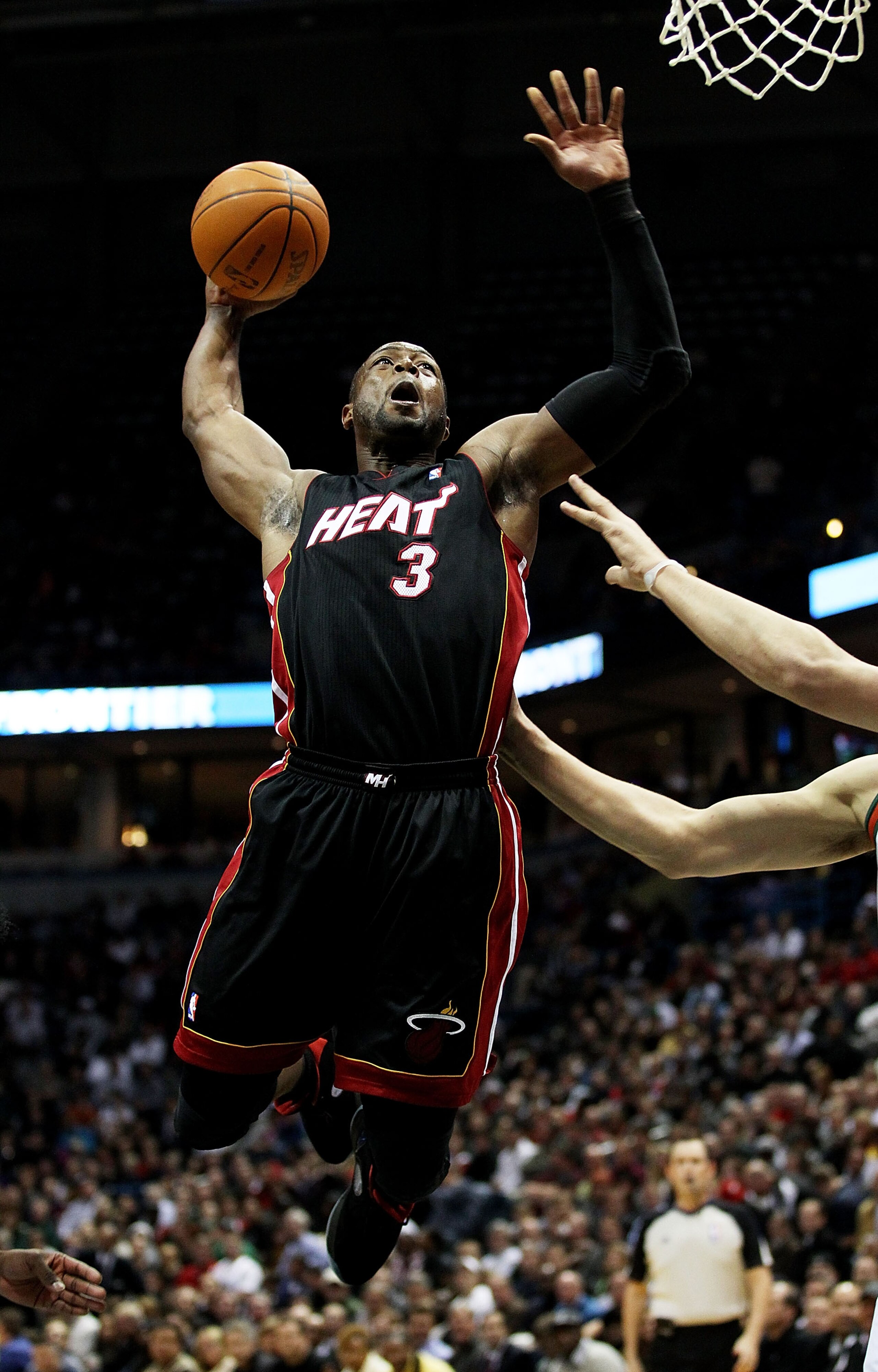 MILWAUKEE, WI - DECEMBER 06: Dwyane Wade #3 of the Miami Heat goes up for a shot against the ilwaukee Bucks at the Bradley Center on December 6, 2010 in Milwaukee, Wisconsin. NOTE TO USER: User expressly acknowledges and agrees that, by downloading and/or