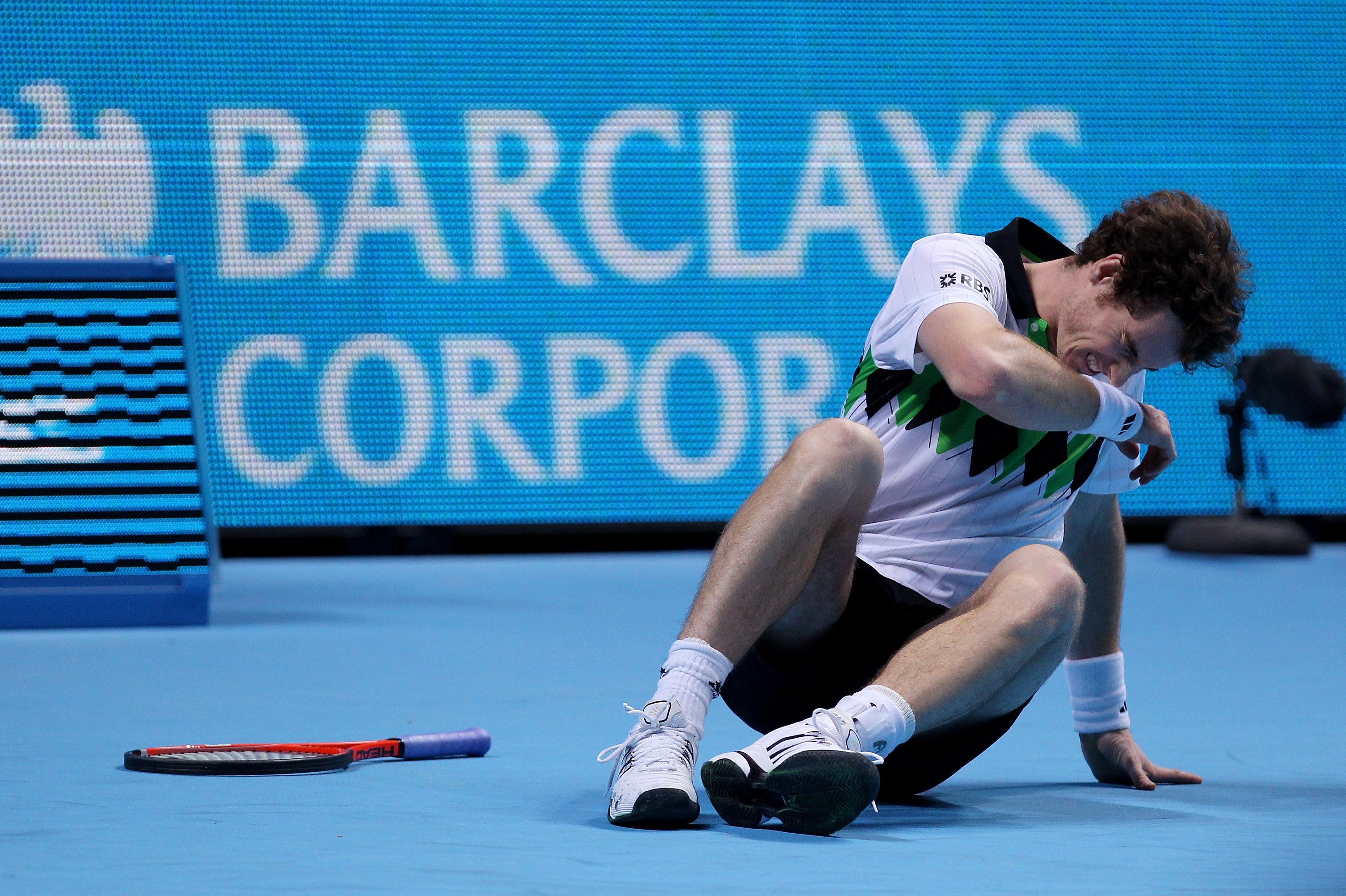LONDON, ENGLAND - NOVEMBER 27:  Andy Murray of Great Britain after falling on the ground during his men's semi-final match against Rafael Nadal of Spain during the ATP World Tour Finals at O2 Arena on November 27, 2010 in London, England.  (Photo by Clive