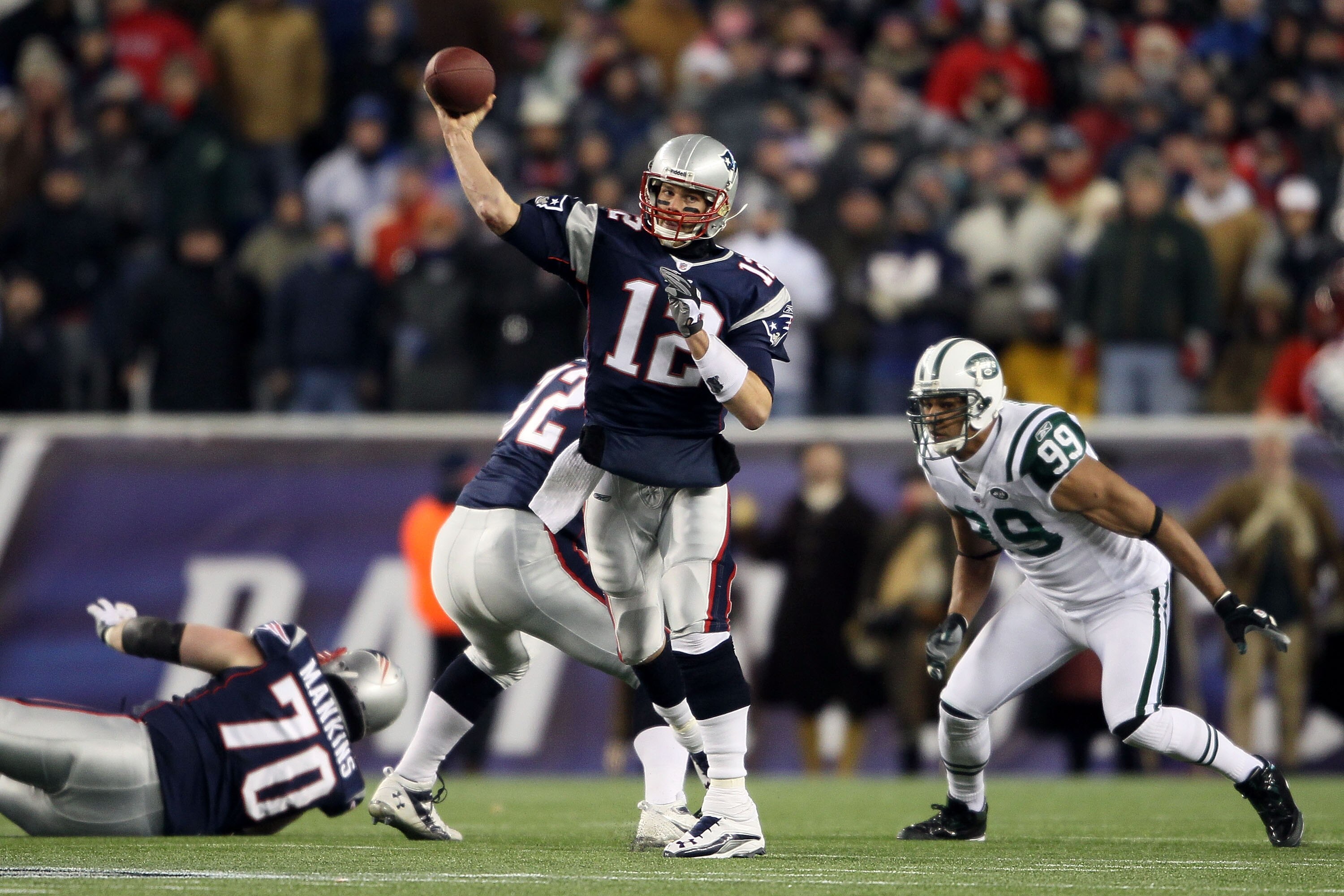 FOXBORO, MA - DECEMBER 06:  Tom Brady #12 of the New England Patriots throws a pass in the first half against the New York Jets at Gillette Stadium on December 6, 2010 in Foxboro, Massachusetts.  (Photo by Elsa/Getty Images)