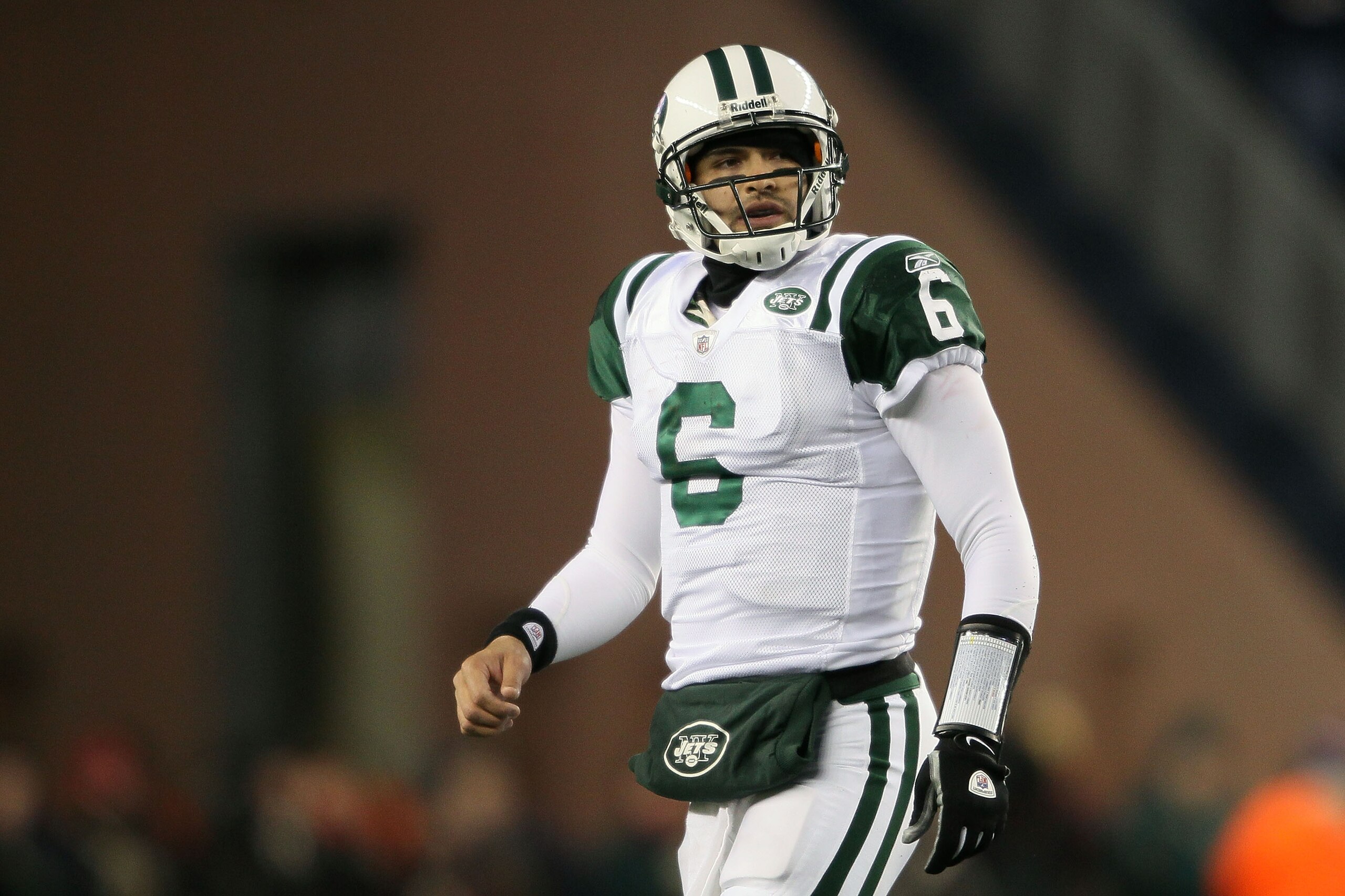 FOXBORO, MA - DECEMBER 06: Mark Sanchez #6 of the New York Jets looks on as he walks towards the sideline after the Jets were forced to punt on a possession in the first quarter against the New England Patriots at Gillette Stadium on December 6, 2010 in FOXBORO, MA - DECEMBER 06: Mark Sanchez #6 of the New York Jets looks on as he walks towards the sideline after the Jets were forced to punt on a possession in the first quarter against the New England Patriots at Gillette Stadium on December 6, 2010 in