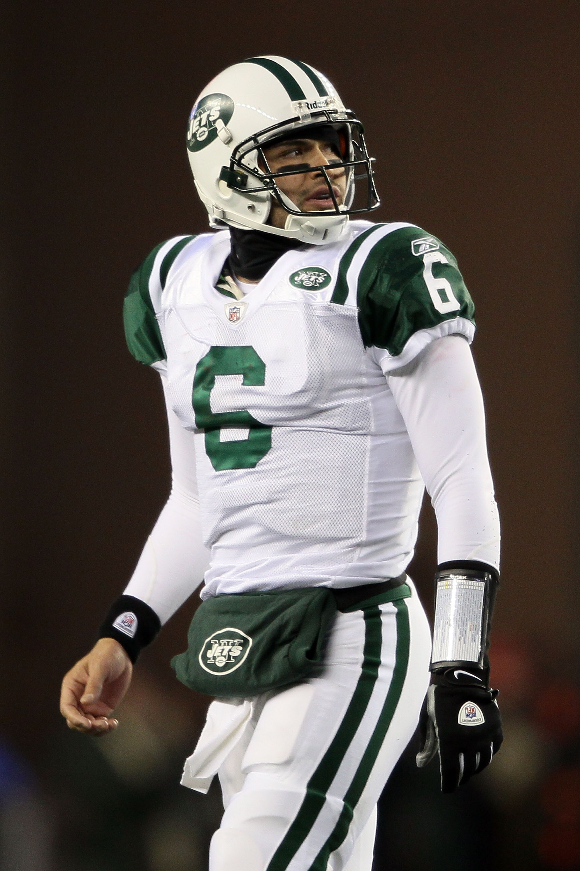 FOXBORO, MA - DECEMBER 06:  Mark Sanchez #6 of the New York Jets looks on as he walks towards the sideline after the Jets were forced to punt on a possession in the first quarter against the New England Patriots at Gillette Stadium on December 6, 2010 in 
