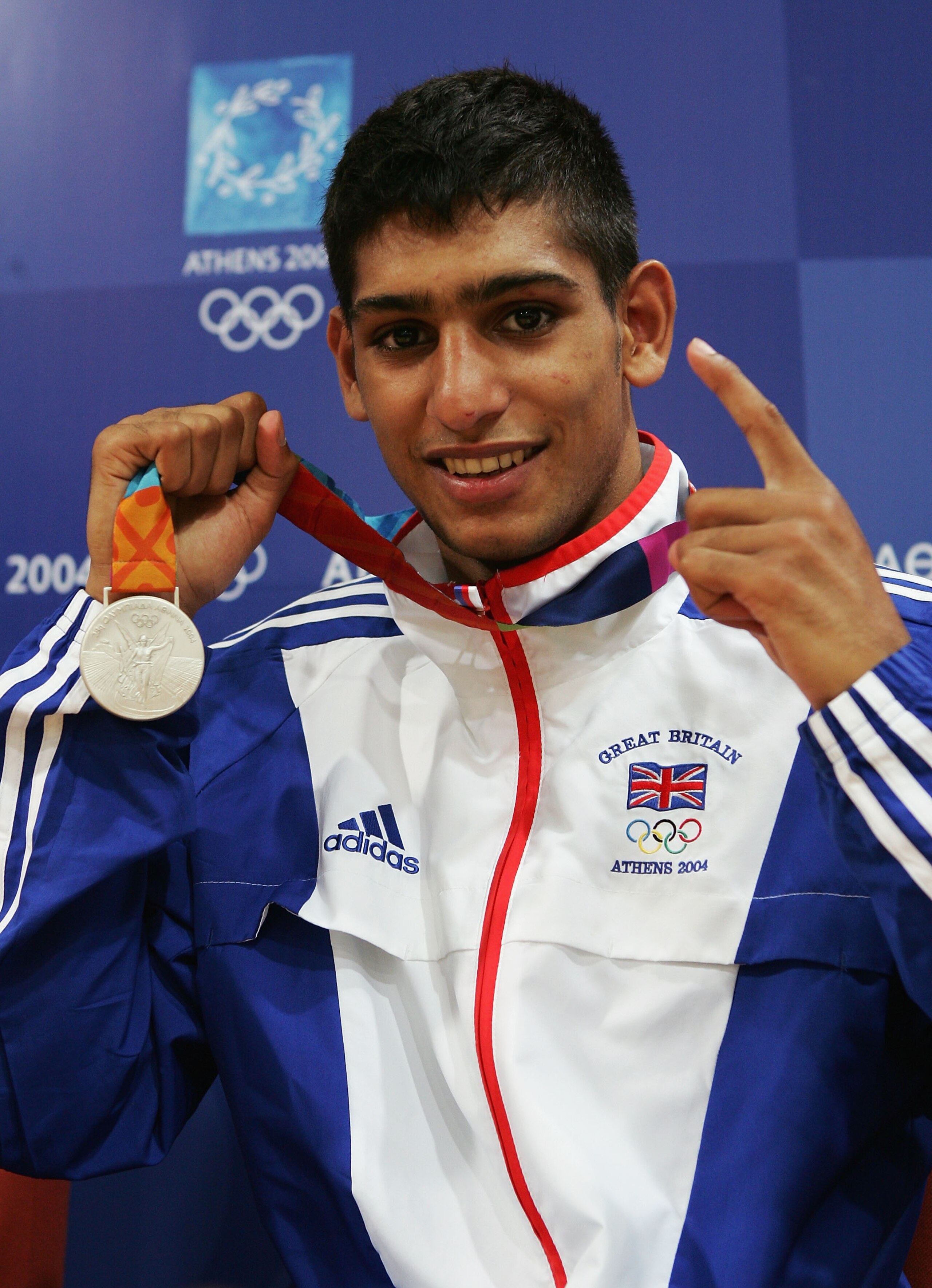 ATHENS - AUGUST 29:  Amir Khan of Great Britain poses with his bronze medal for the men's boxing 60 kg event on August 29, 2004 during the Athens 2004 Summer Olympic Games at Peristeri Olympic Boxing Hall in Athens, Greece. (Photo by Getty Images)