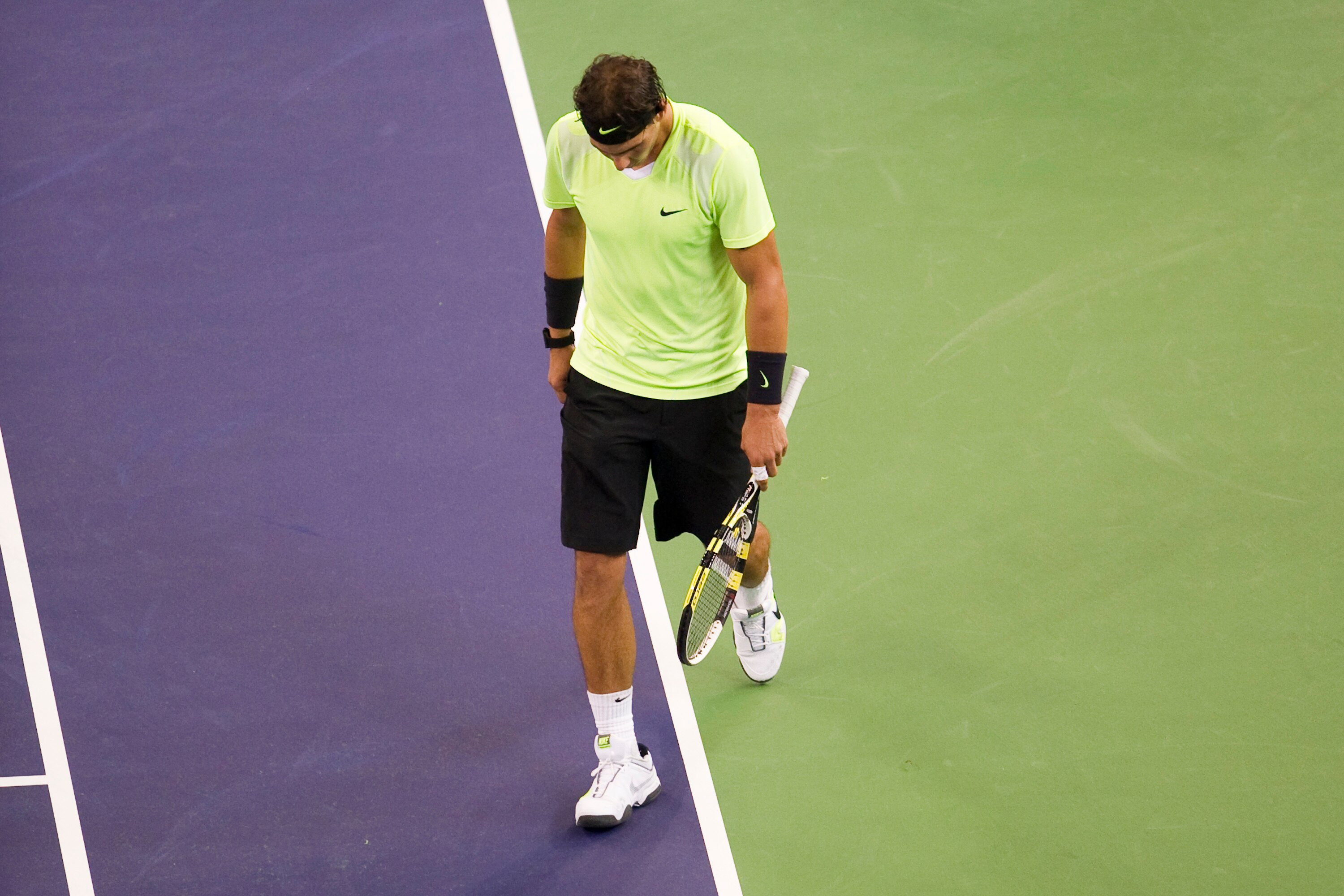 SHANGHAI, CHINA - OCTOBER 14:  Rafael Nadal of Spain reacts after loosing a point against Jurgen Melzer of Austria during day four of the 2010 Shanghai Rolex Masters at the Shanghai Qi Zhong Tennis Center on October 14, 2010 in Shanghai, China.  (Photo by