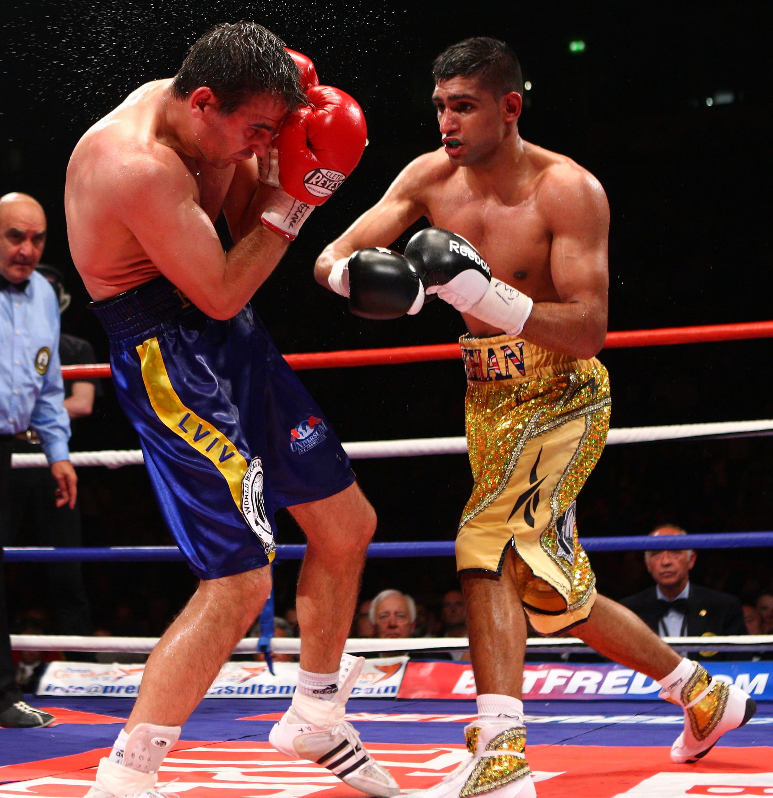 MANCHESTER, ENGLAND - JULY 18:  Amir Khan throws a right cross on his way to beating  Andreas Kotelnik to become the new WBA Light Welterweight Champion  on July 18, 2009  at the MEN Arena in Manchester, England.  (Photo by John Gichigi/Getty Images)