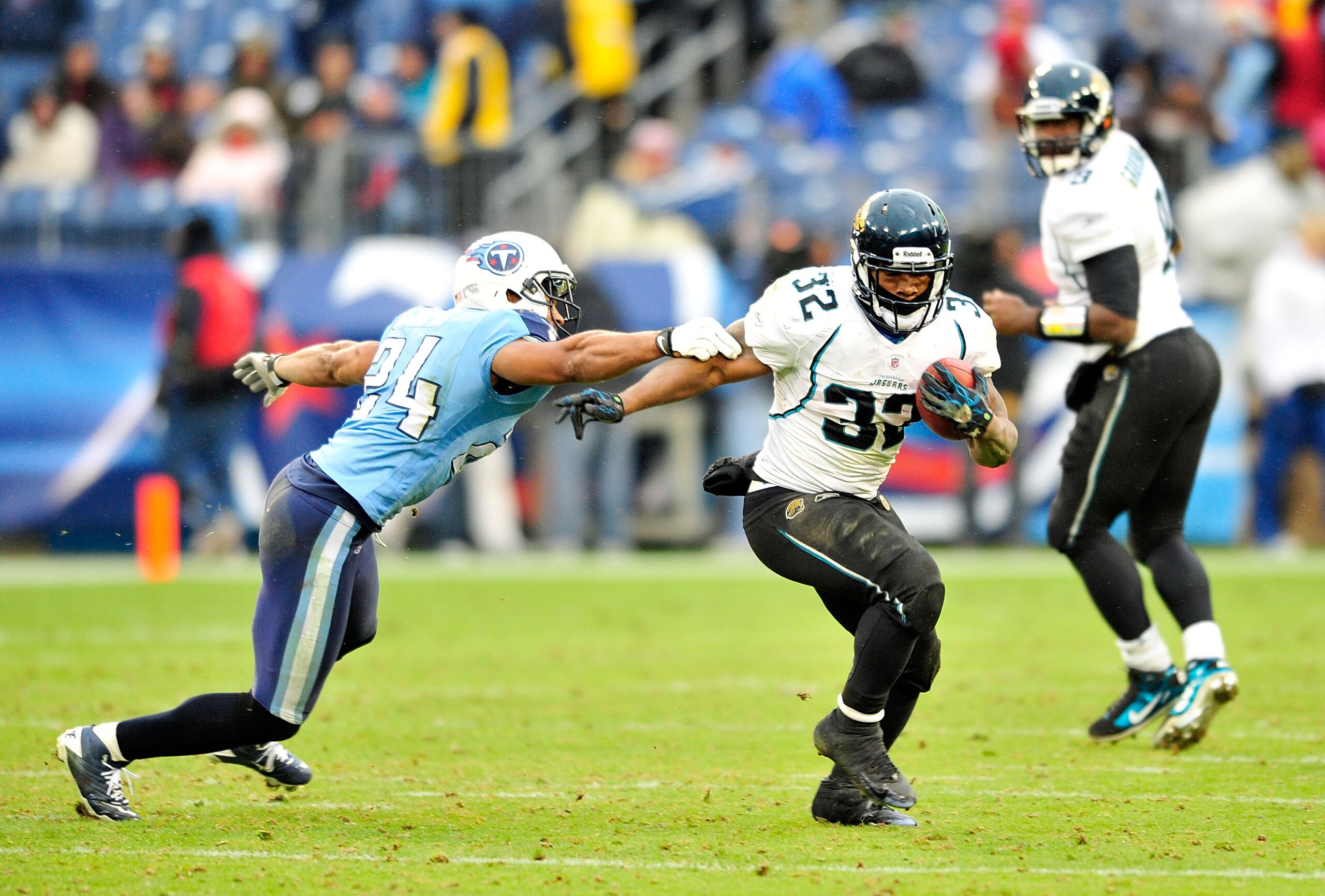 NASHVILLE, TN - DECEMBER 05:  Maurice Jones-Drew #32 of the Jacksonville Jaguars breaks away from Chris Hope #24 of the Tennessee Titans  during the first half at LP Field on December 5, 2010 in Nashville, Tennessee. The Jaguars won 17-6.  (Photo by Grant