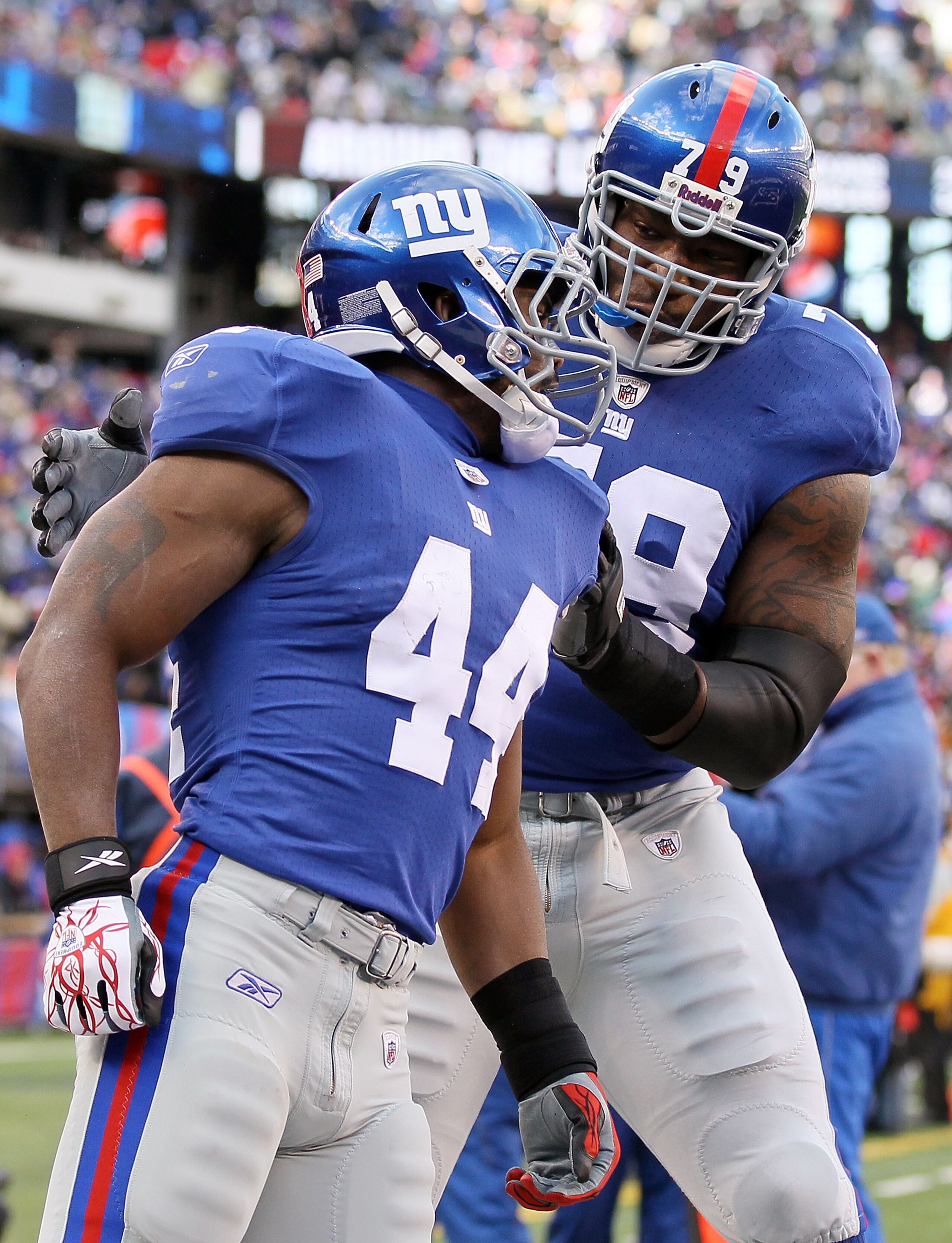 EAST RUTHERFORD, NJ - DECEMBER 05:  Ahmad Bradshaw #44 of the New York Giants celebrates his first quarter touchdown against the Washington Redskins with teammate Jamon Meredith #79 on December 5, 2010 at the New Meadowlands Stadium in East Rutherford, Ne