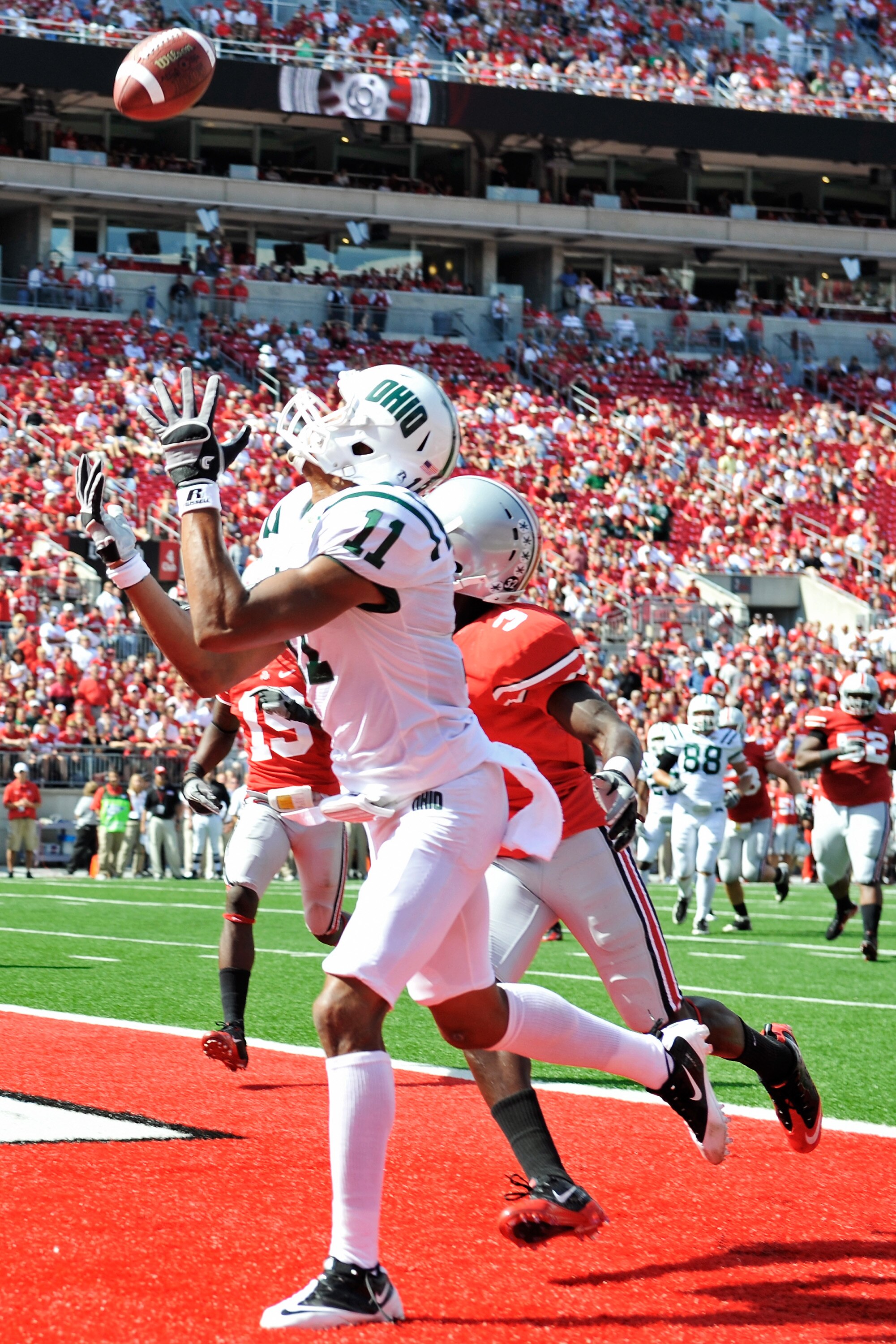 COLUMBUS, OH - SEPTEMBER 18:  Terrence McCrae #11of the Ohio Bobcats catches a touchdown pass in the fourth quarter as Corey Brown #3 of the Ohio State Buckeyes defends at Ohio Stadium on September 18, 2010 in Columbus, Ohio. Ohio State defeated Ohio 43-7