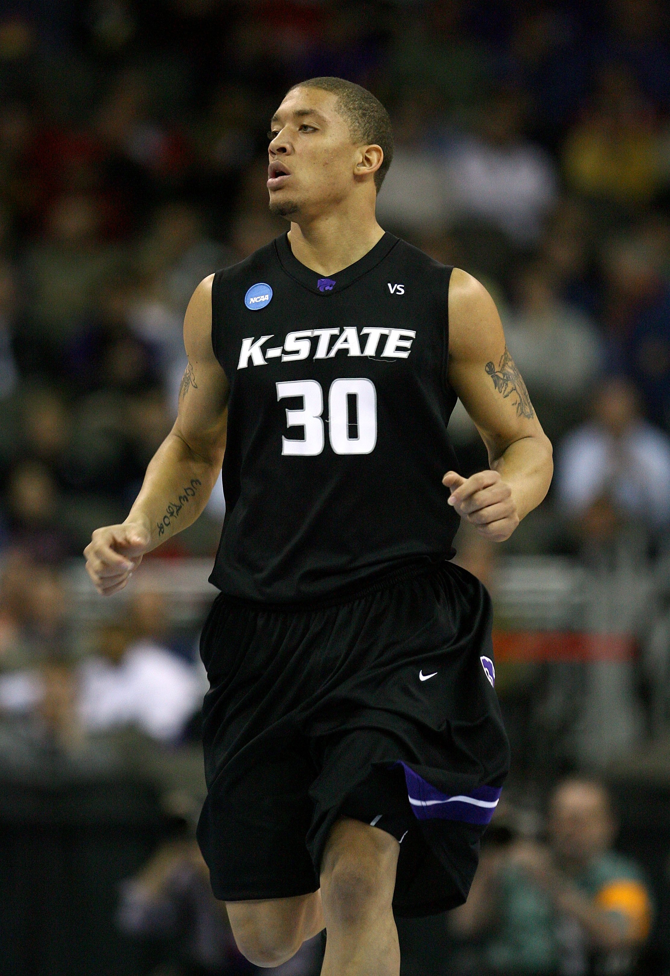 OMAHA, NE - MARCH 20:  Michael Beasley #30 of the Kansas State Wildcats runs up court against the USC Trojans during the Midwest Region first round of the 2008 NCAA Men's Basketball Tournament on March 20, 2008 at the Qwest Center in Omaha, Nebraska. Kans