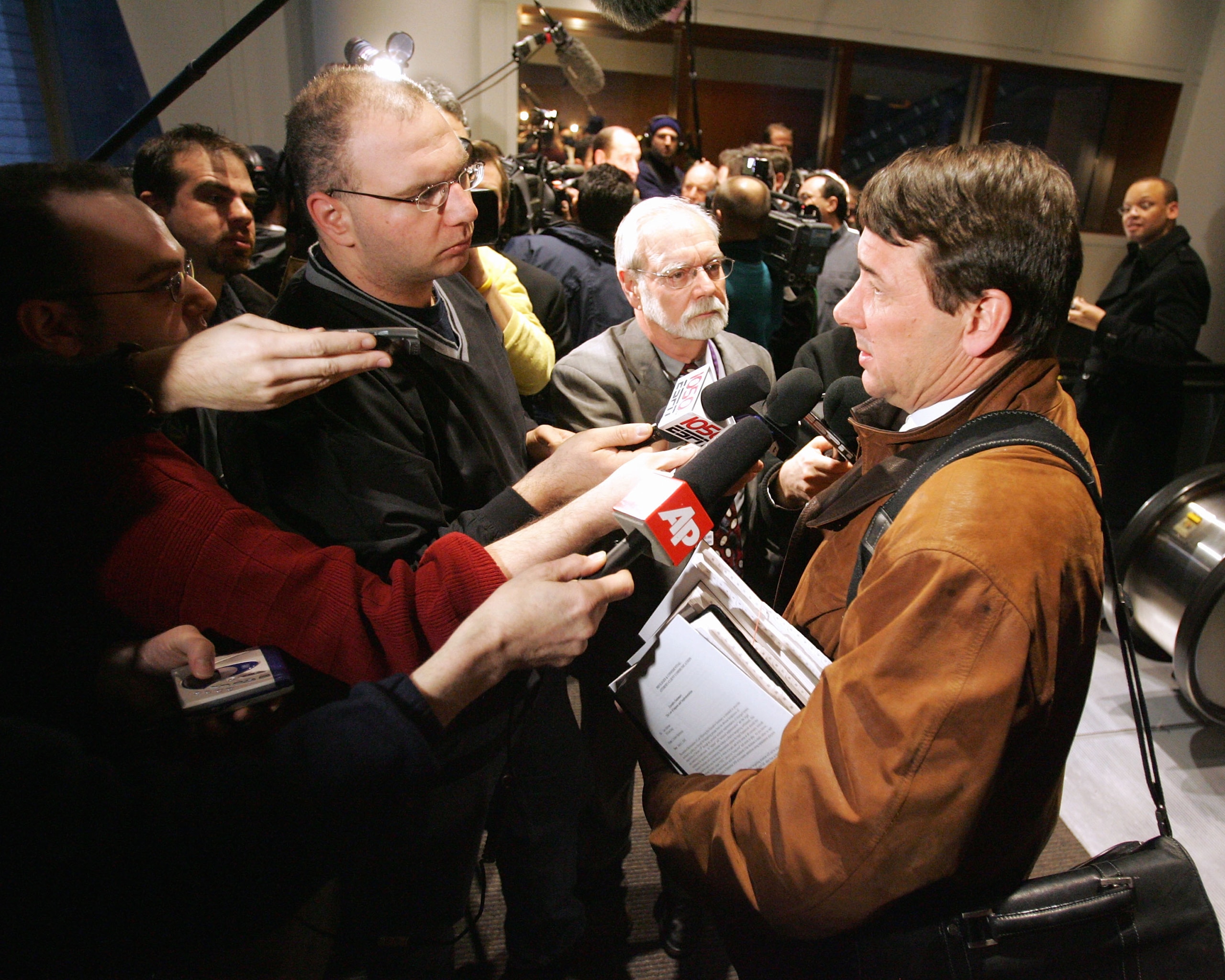 NEW YORK - MARCH 1:  Mike Milbury (R), General Manager of the New York Islanders, addresses the media following the National Hockey League Board of Governors meeting March 1, 2005 at the Westin Hotel at Times Square in New York City.  (Photo by Bruce Benn