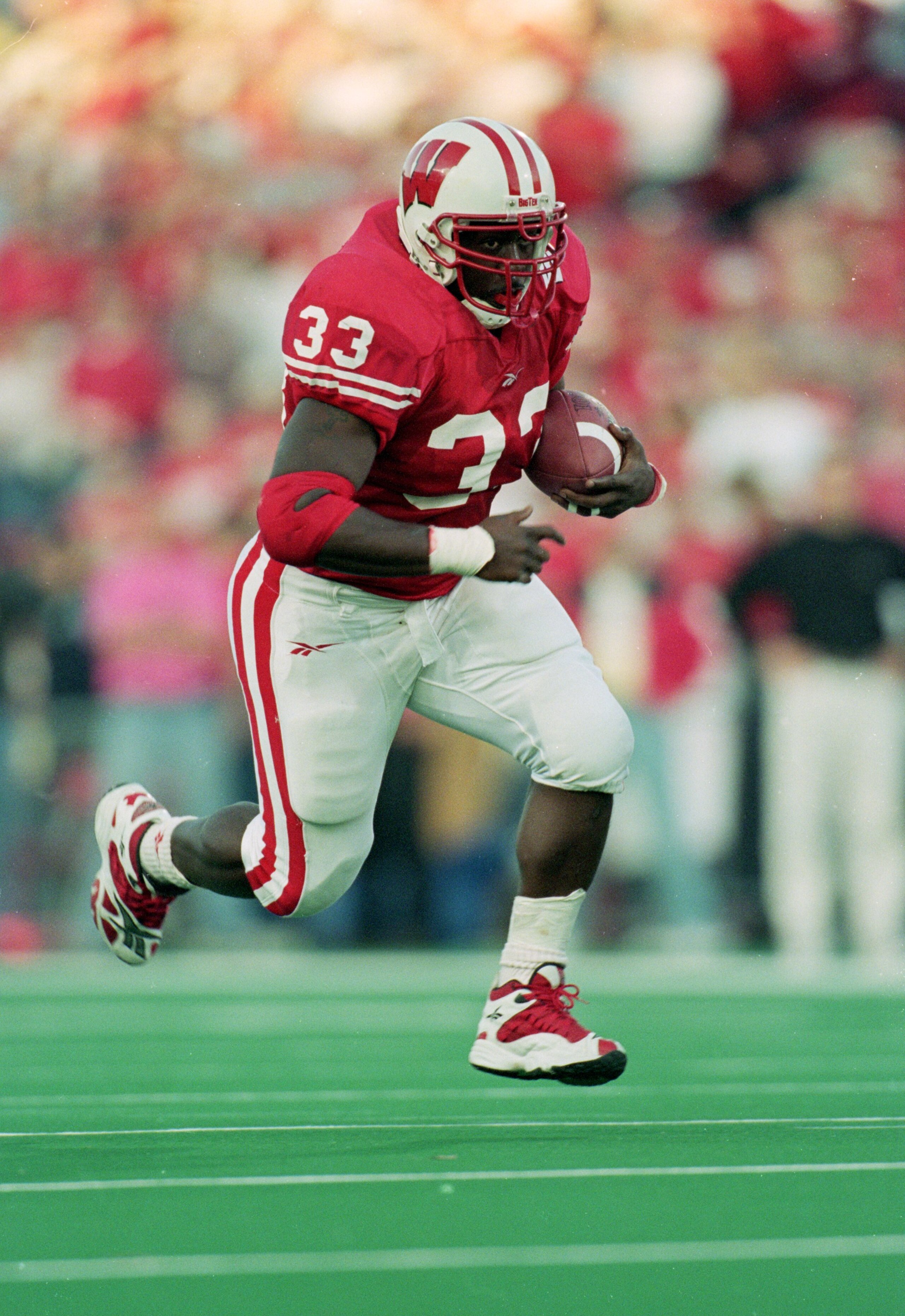 13 Nov 1999: Ron Dayne #33 of the Wisconsin Badgers carries the ball  during the game against the  Iowa Hawkeyes at the Camp Randall Stadium in Madison, Wisconsin. The Badgers defeated the Hawkeyes 41-3. Mandatory Credit: Matthew Stockman  /Allsport
