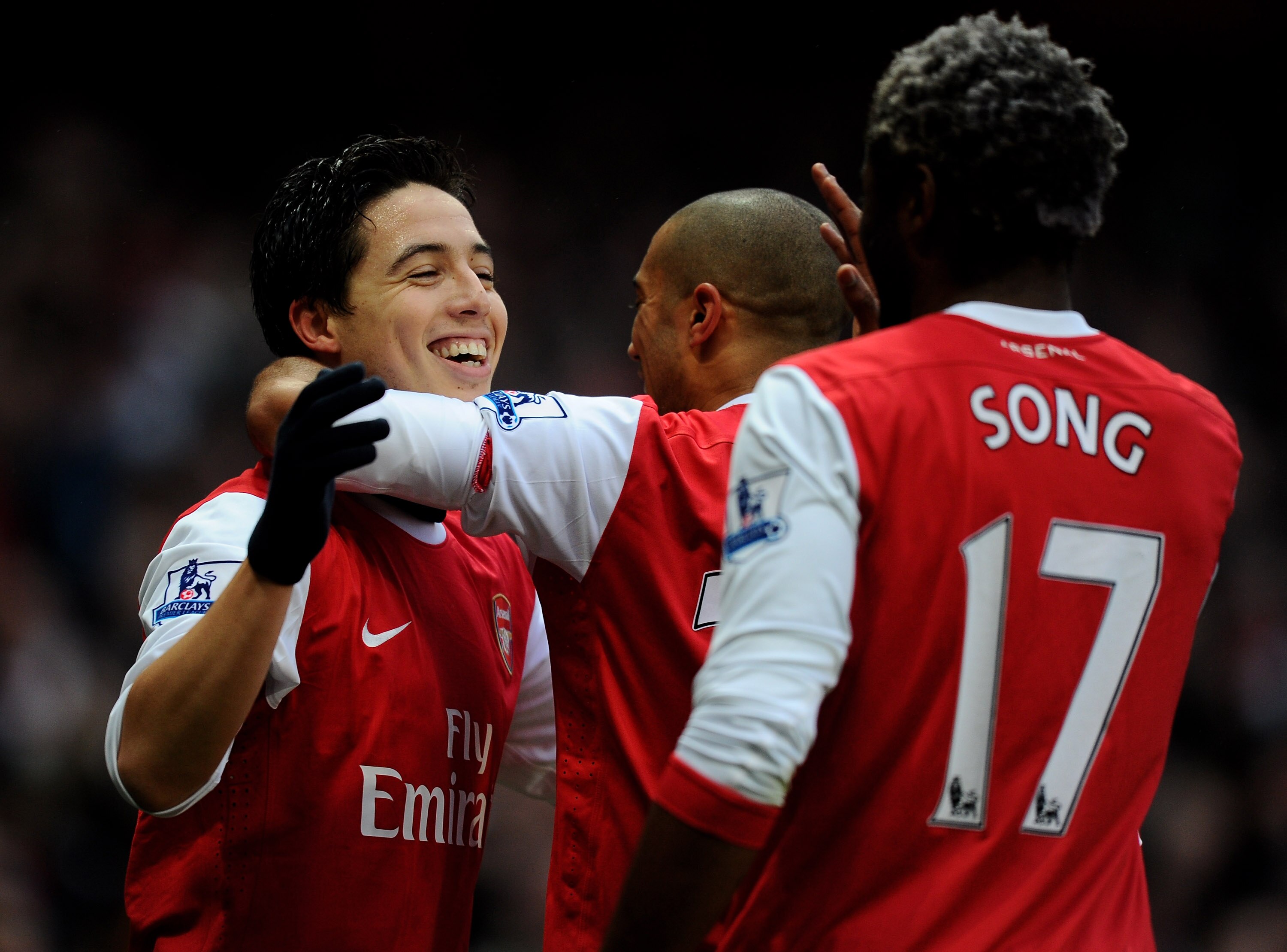 LONDON, ENGLAND - DECEMBER 04:  Samir Nasri (L) of Arsenal is congratulated by teammates after scoring the opening goal during the Barclays Premier League match between Arsenal and Fulham at the Emirates Stadium on December 4, 2010 in London, England.  (P