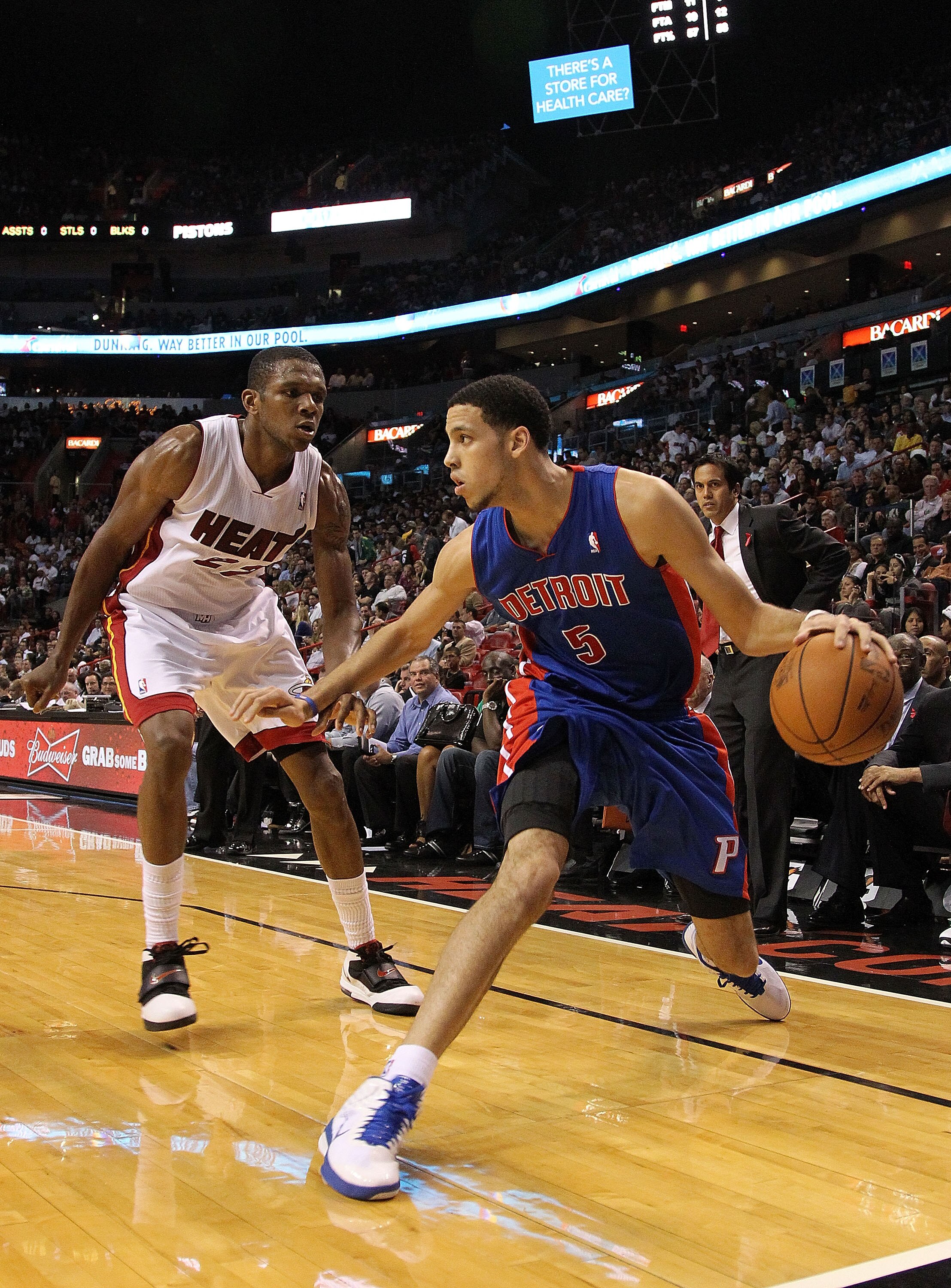 MIAMI, FL - DECEMBER 01:  Austin Daye #5 of the Detroit Pistons dribbles around  James Jones #22 of the Miami Heat during a game at American Airlines Arena on December 1, 2010 in Miami, Florida. NOTE TO USER: User expressly acknowledges and agrees that, b
