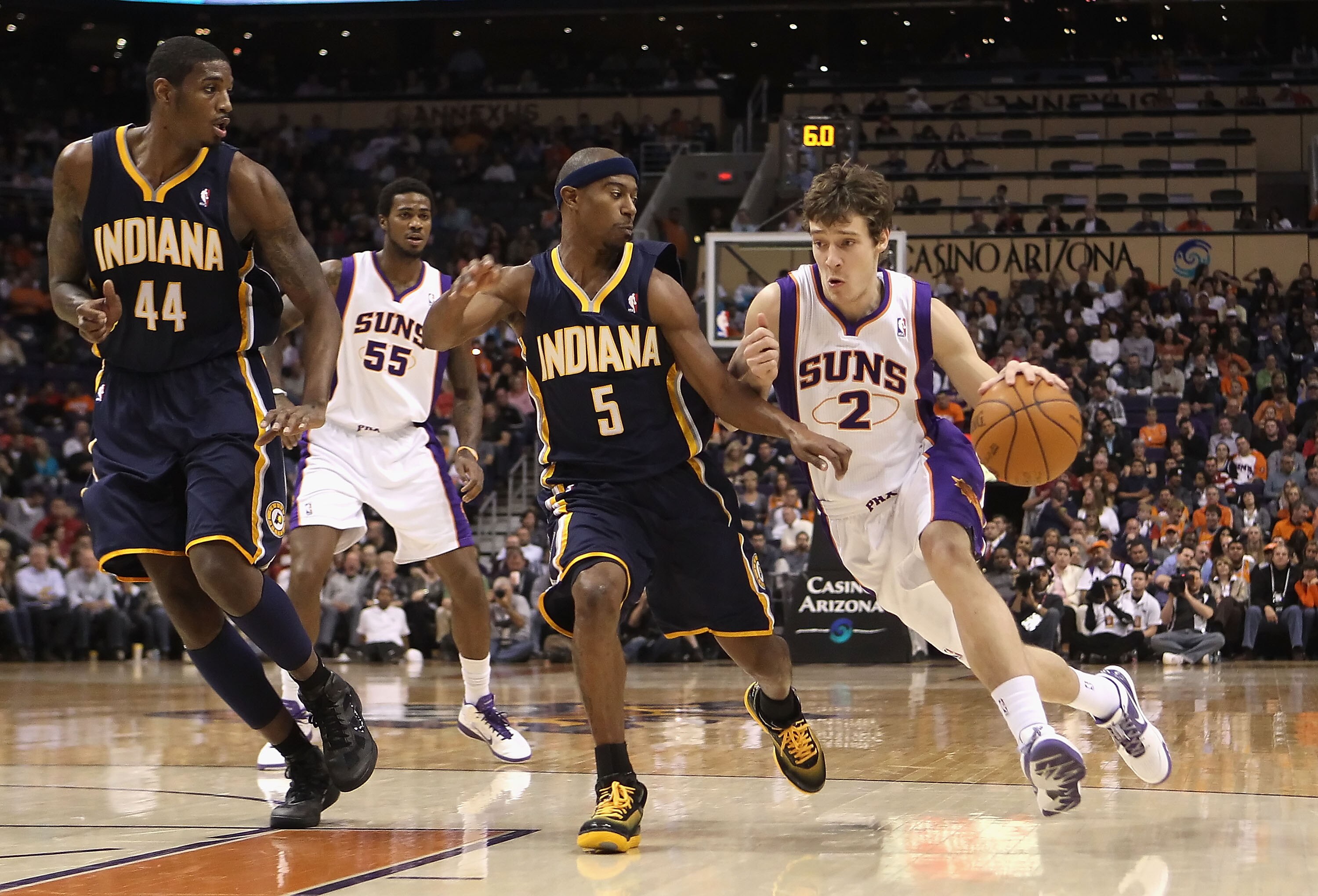 PHOENIX - DECEMBER 03:  Goran Dragic #2 of the Phoenix Suns drives with the ball against T.J. Ford #5 of the Indiana Pacers during the NBA game at US Airways Center on December 3, 2010 in Phoenix, Arizona.  The Suns defeated the Pacers 105-97.  NOTE TO US