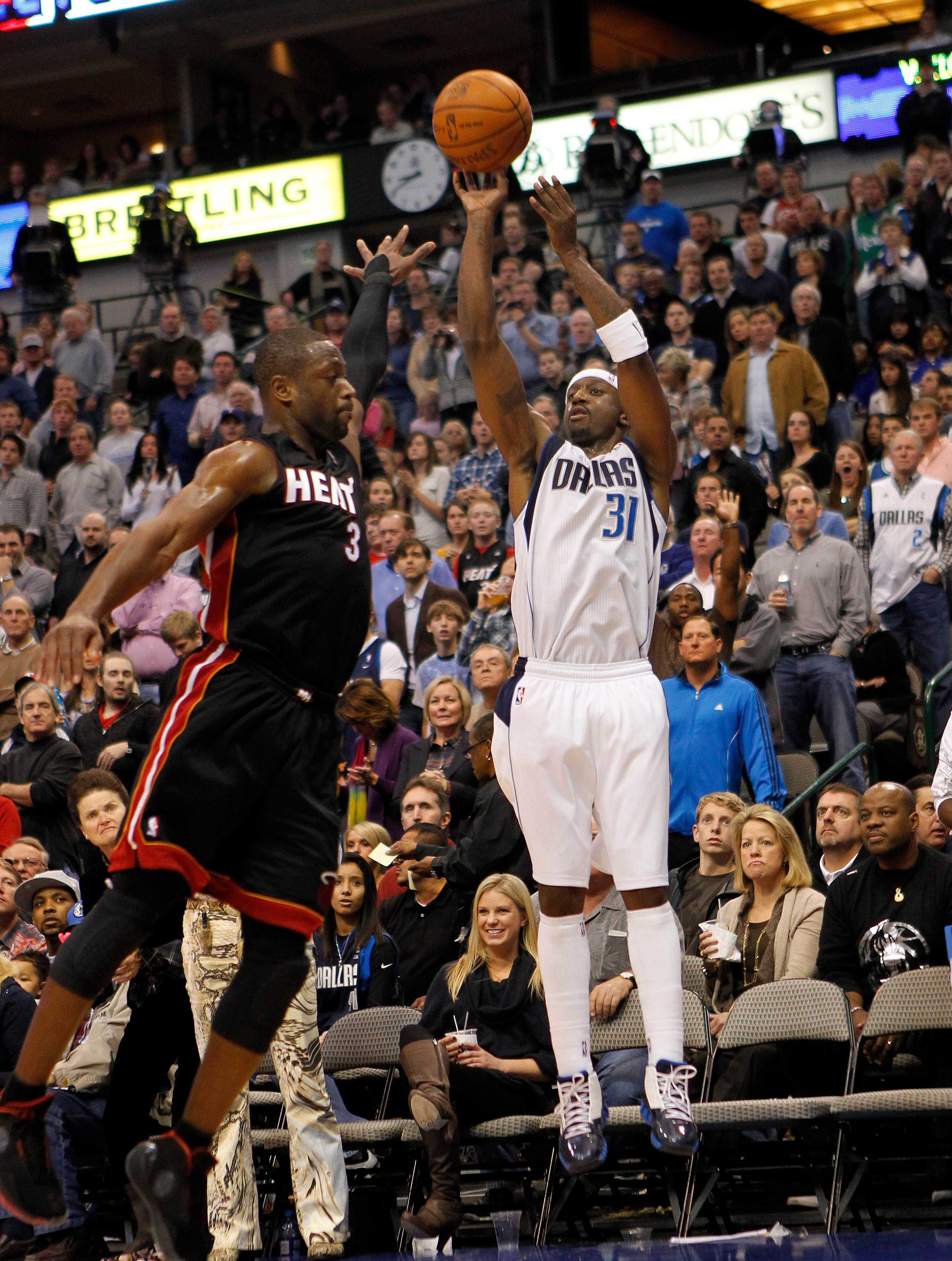 DALLAS - NOVEMBER 27: Jason Terry #31 of the Dallas Mavericks shoots over Dwyane Wade #3 of the Miami Heat on November 27, 2010 at the American Airlines Center in Dallas, Texas. NOTE TO USER: User expressly acknowledges and agrees that, by downloading and