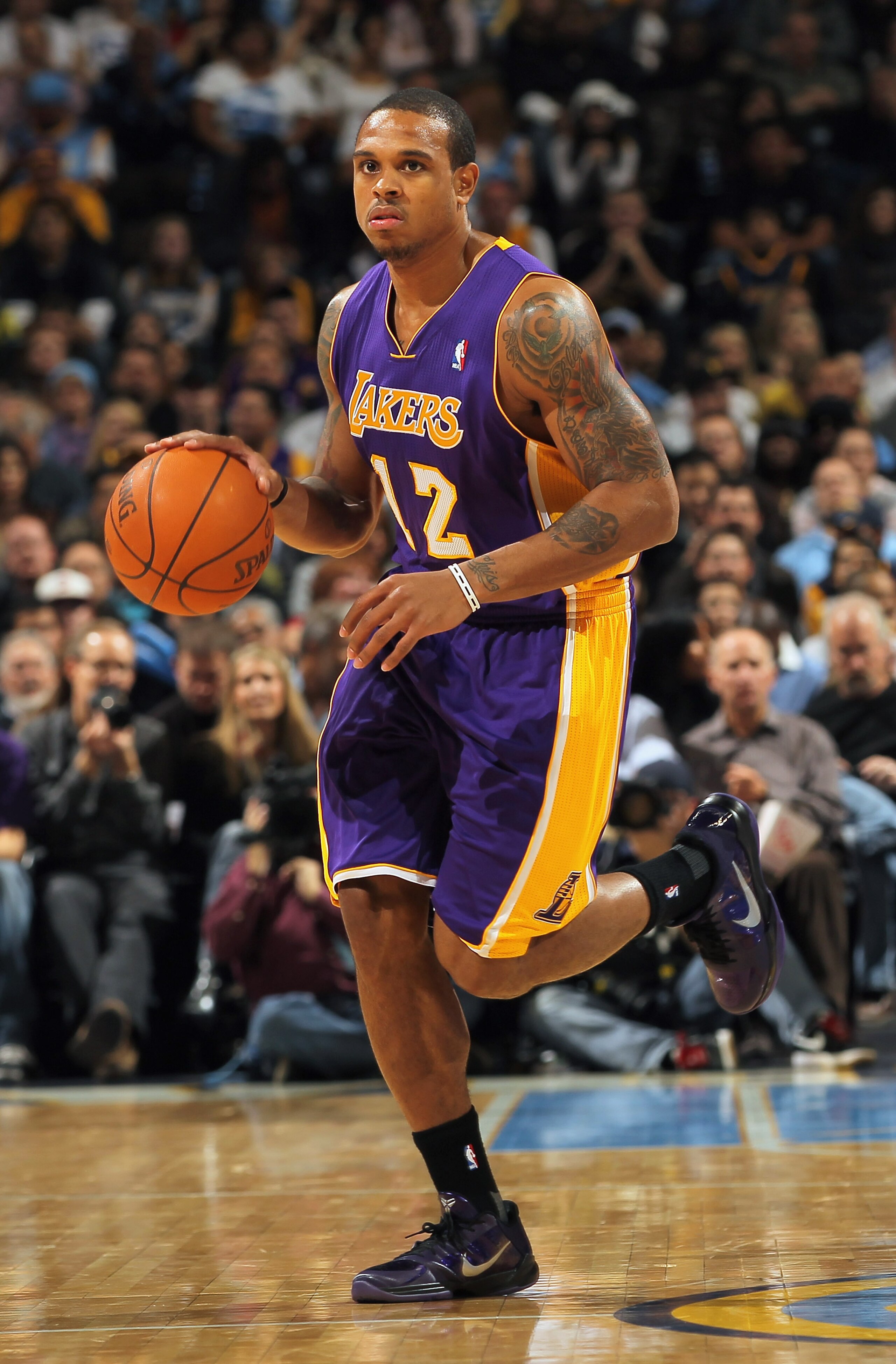 DENVER - NOVEMBER 11:  Shannon Brown #12 of the Los Angeles Lakers controls the ball against the Denver Nuggets at the Pepsi Center on November 11, 2010 in Denver, Colorado. The Nuggets defeated the Lakers 118-112.  NOTE TO USER: User expressly acknowledg