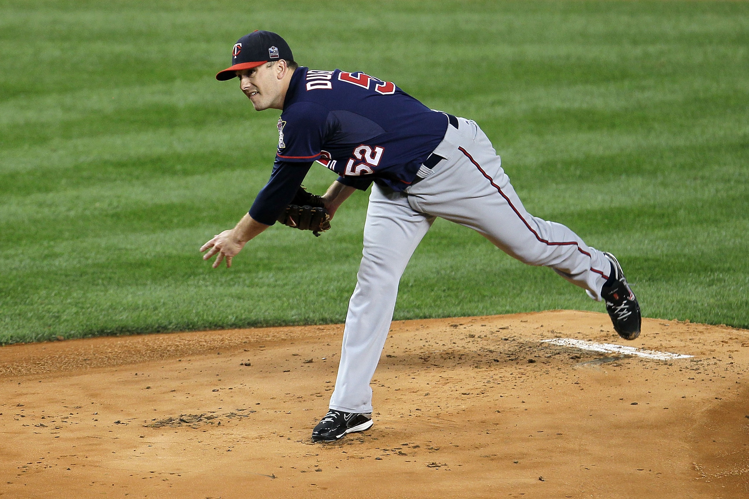 NEW YORK - OCTOBER 09:  Starting pitcher Brian Duensing #52 of the Minnesota Twins throws a pitch against the New York Yankees during Game Three of the ALDS part of the 2010 MLB Playoffs at Yankee Stadium on October 9, 2010 in the Bronx borough of New Yor