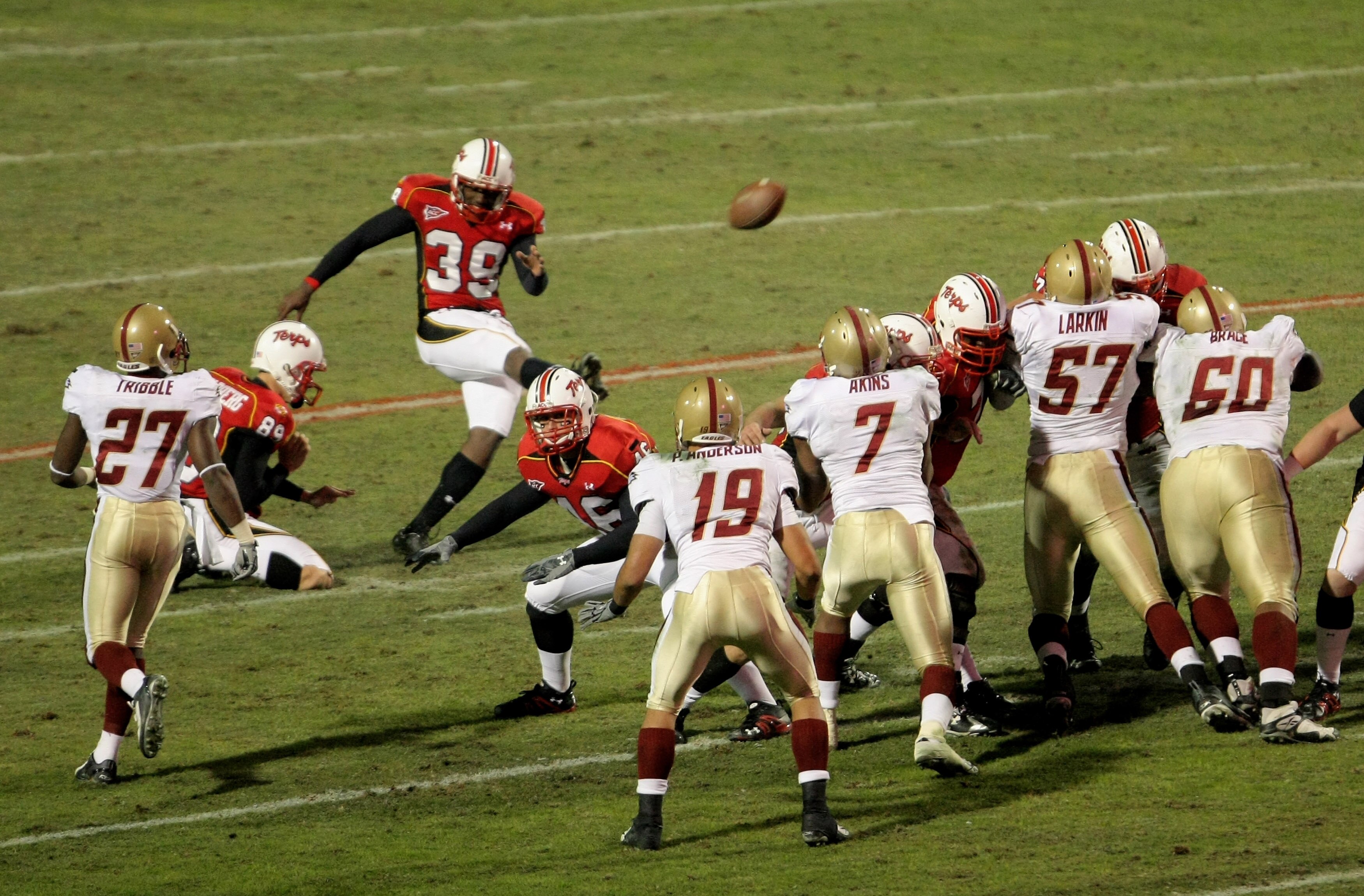 COLLEGE PARK, MD - NOVEMBER 10:  Place kicker Obi Egekeze #39 of the Maryland Terrapins kicks a 25 yard field goal with :15 seconds remaining in the half to give the Terps a 20-14 halftime lead over the Boston College Eagles at Byrd Stadium on November 10