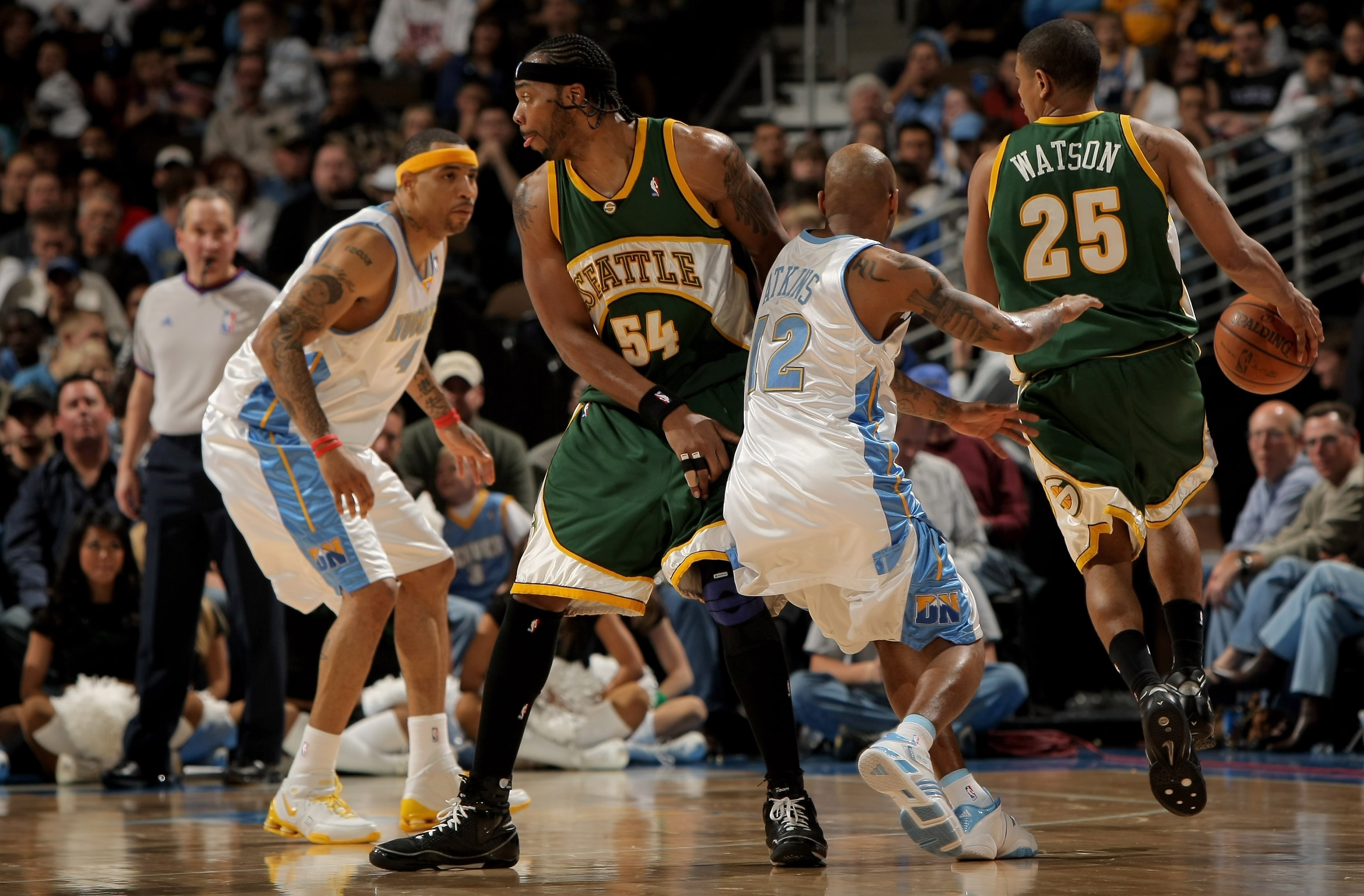 DENVER - MARCH 16:  Chris Wilcox #54 of the Seattle SuperSonics sets a pick on Chucky Atkins #12 of the Denver Nuggets for teammate Earl Watson #25 as Kenyon Martin #4 of the Nuggets helps with the defense at the Pepsi Center on March 16, 2008 in Denver,