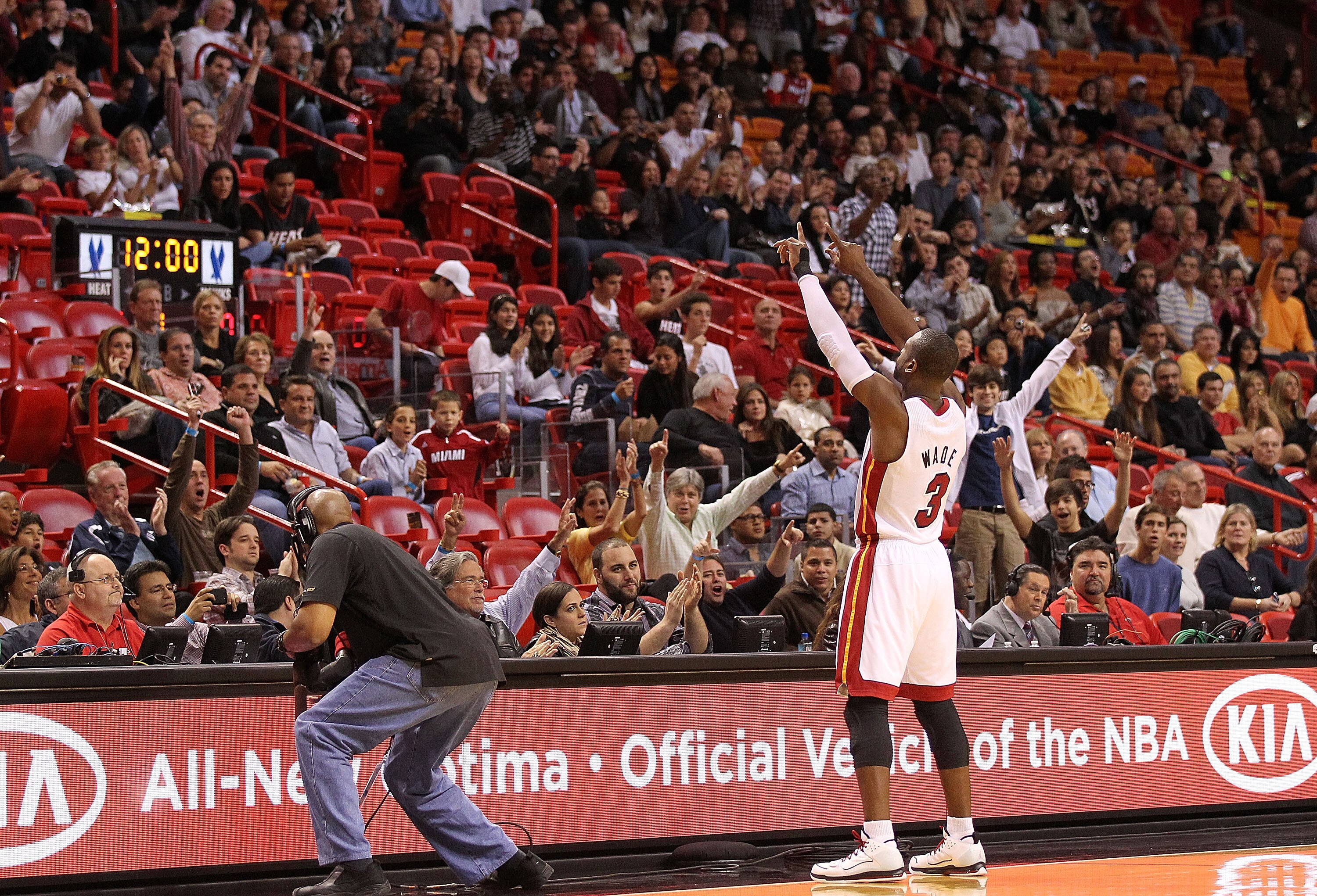 MIAMI, FL - DECEMBER 04:  Dwyane Wade #3 of the Miami Heat greets the crowd during a game against the Atlanta Hawks at American Airlines Arena on December 4, 2010 in Miami, Florida. NOTE TO USER: User expressly acknowledges and agrees that, by downloading